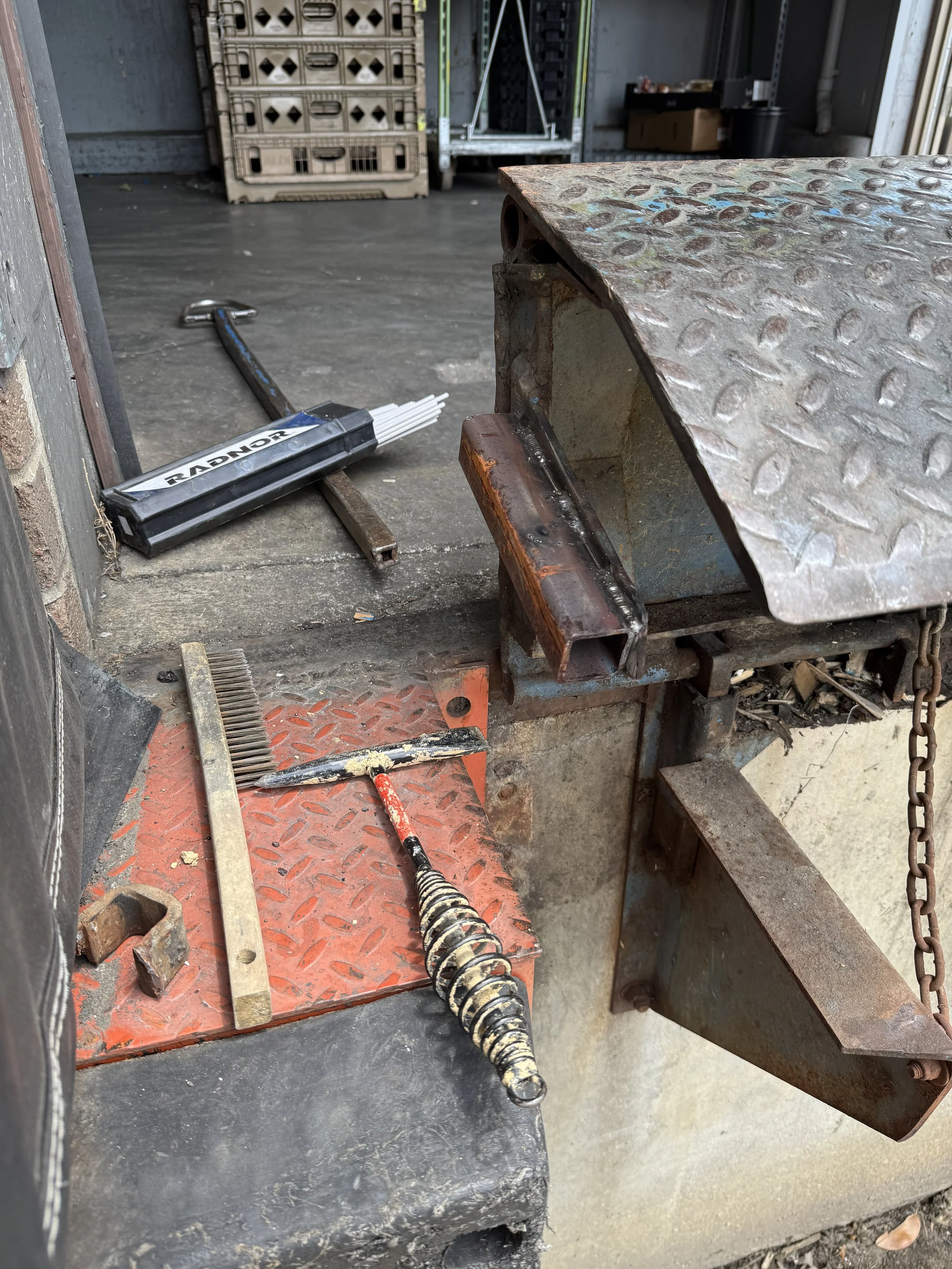 Mobile welding service repairing damaged loading dock plate on site