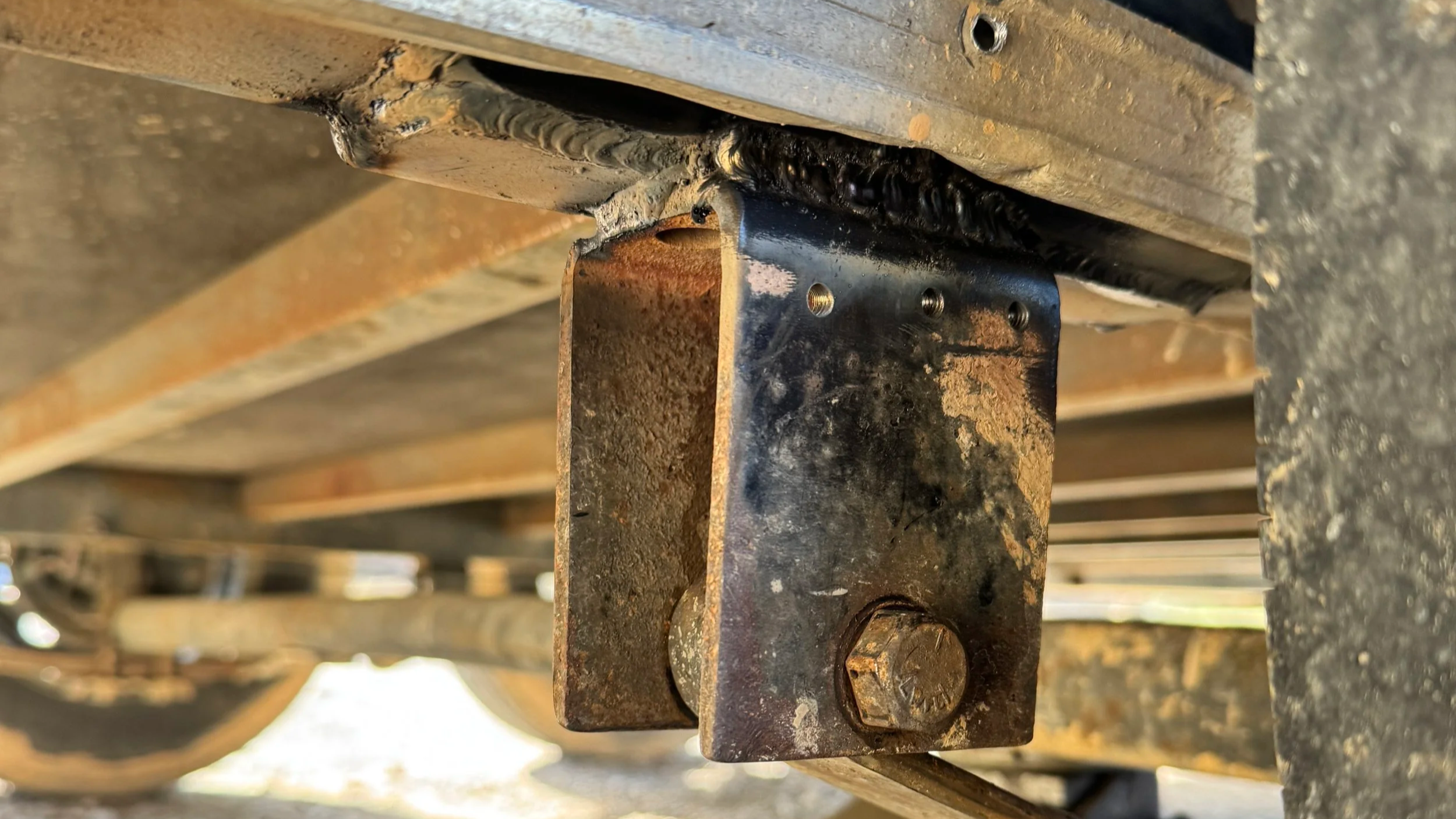 Repaired trailer spring hanger with new frame patch welded and reinstalled in Corbin Kentucky