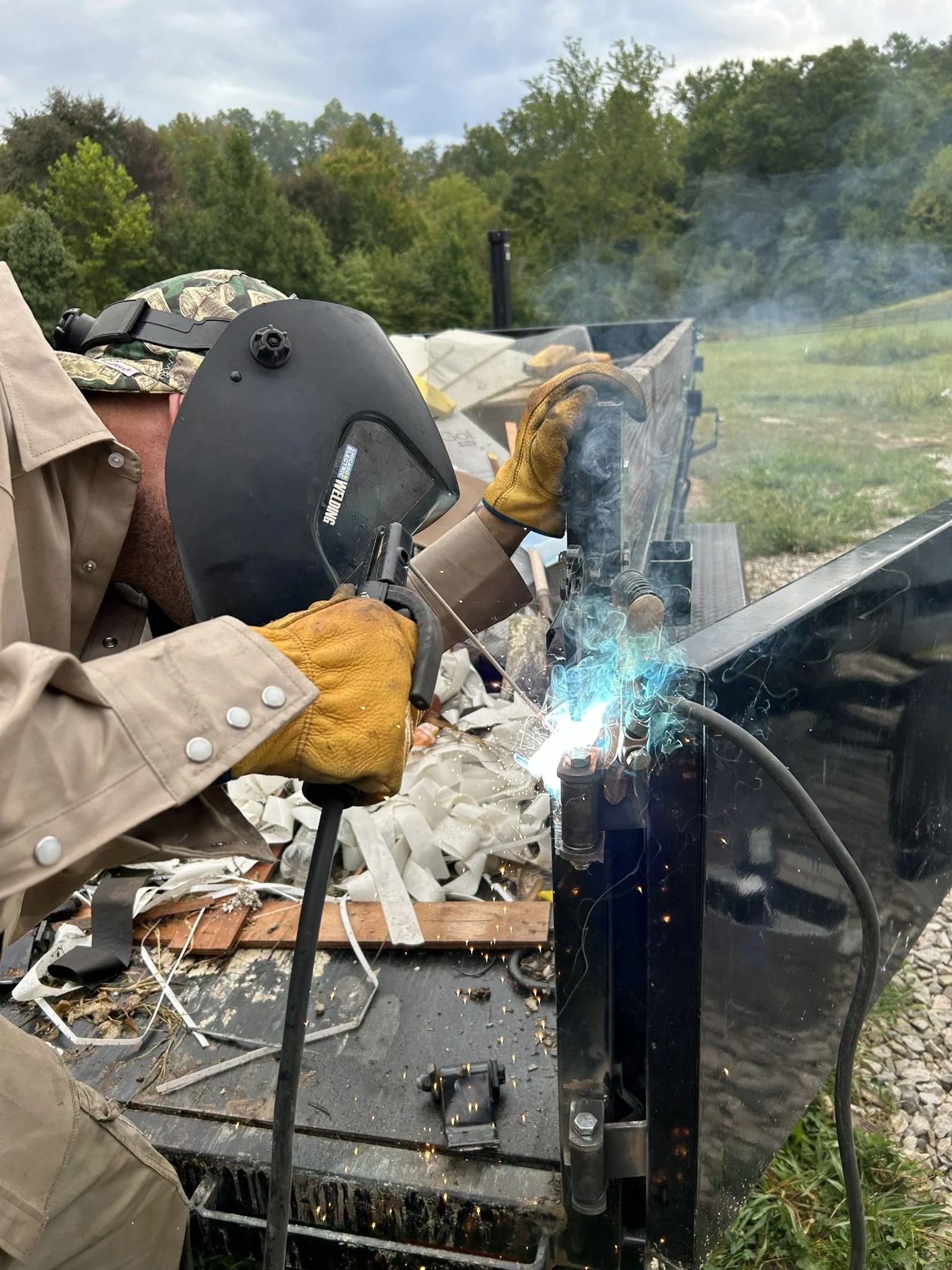 welding repair on utility trailer ramp at McCarty Fabrication shop