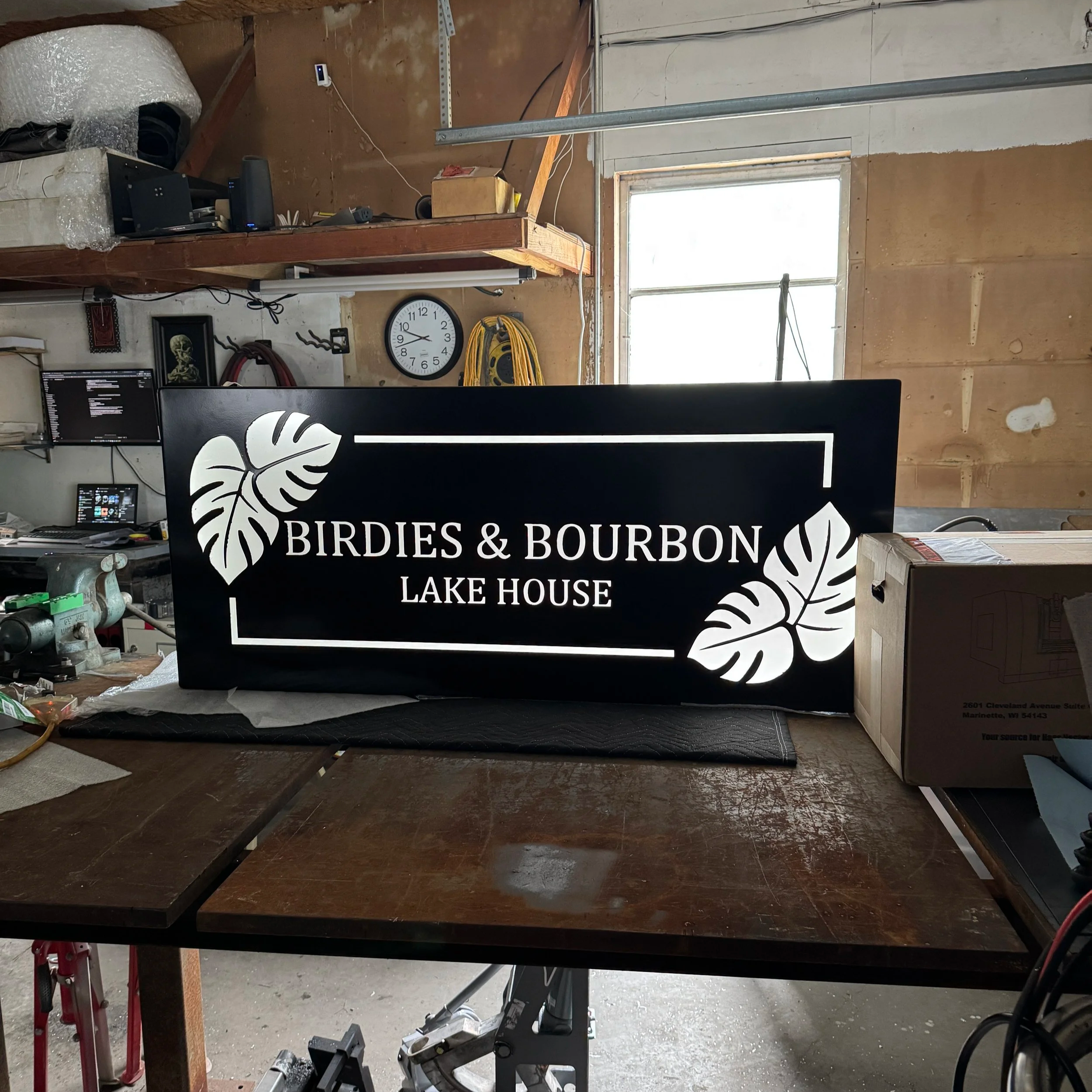 Finished custom illuminated aluminum sign fabricated for Birdies & Bourbon Lake House in Kentucky