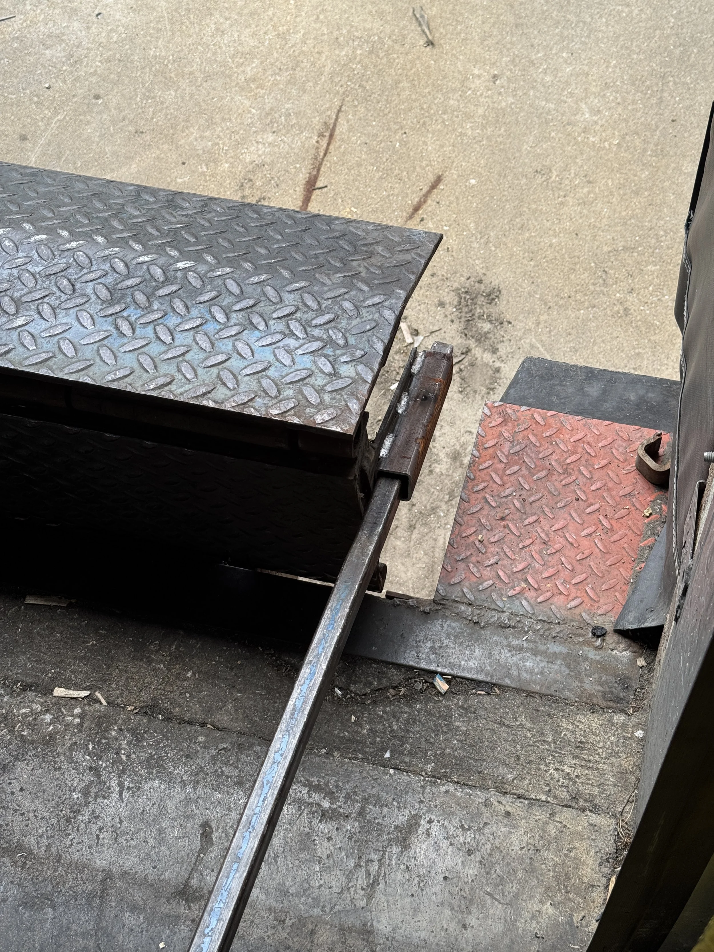 Welded reinforcement tubing installed on commercial loading dock plate