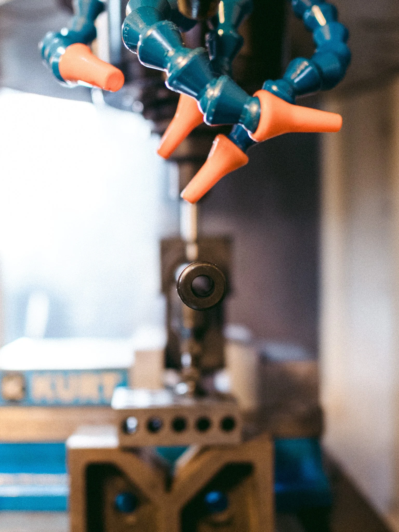 Aluminum workpiece fixtured on CNC mill during custom machining operations at McCarty Fabrication in Corbin, KY.