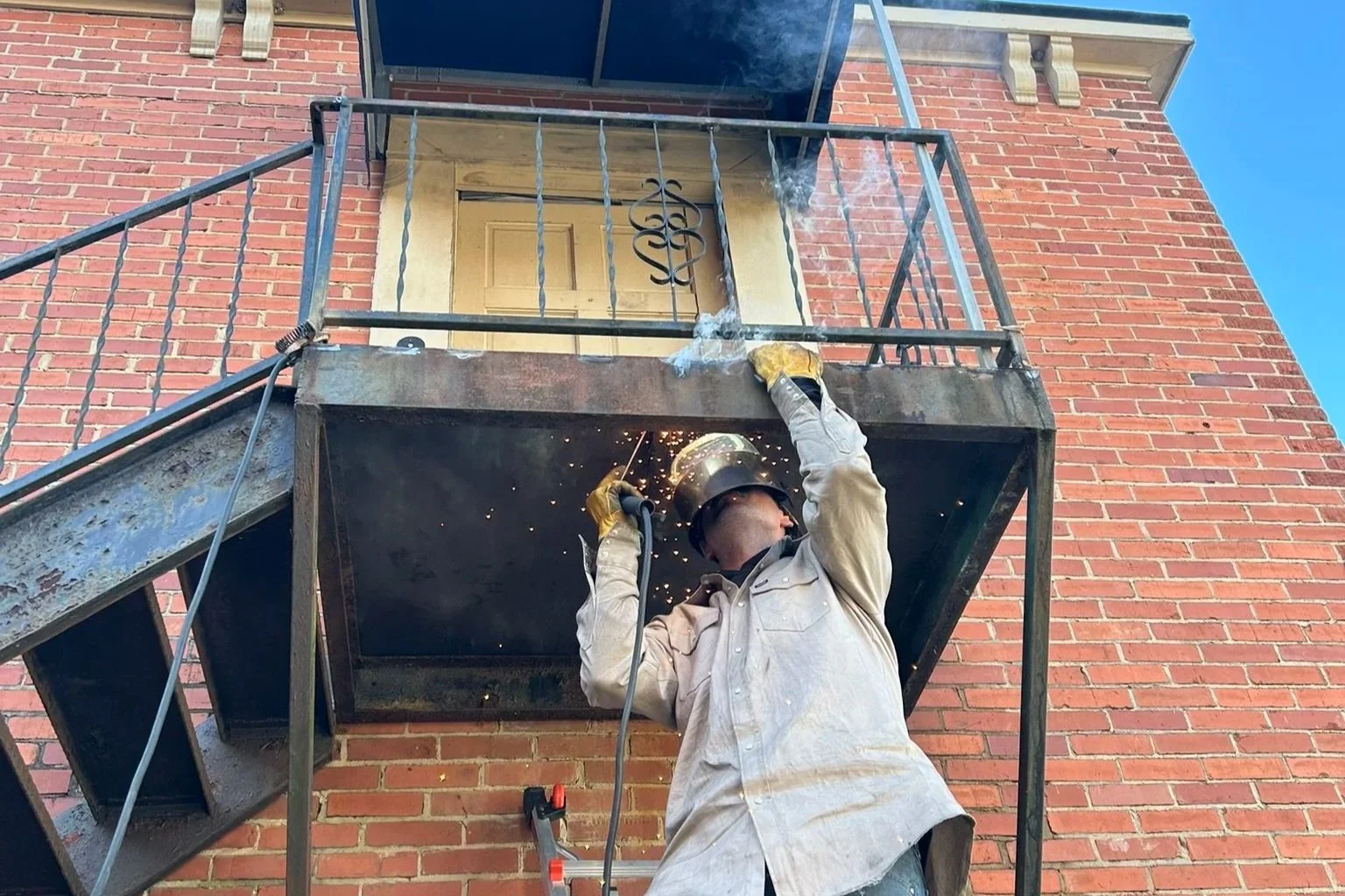 Handrail repair and reinforcement weld on exterior steps London Kentucky