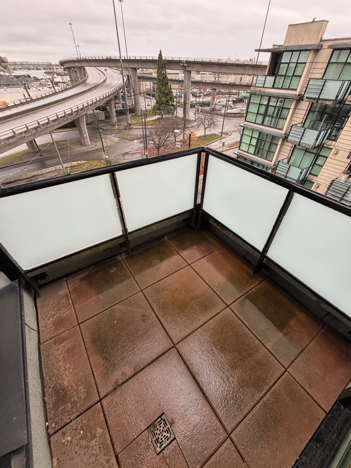 Dirty balcony prior to BalcoScrub's balcony deep cleaning