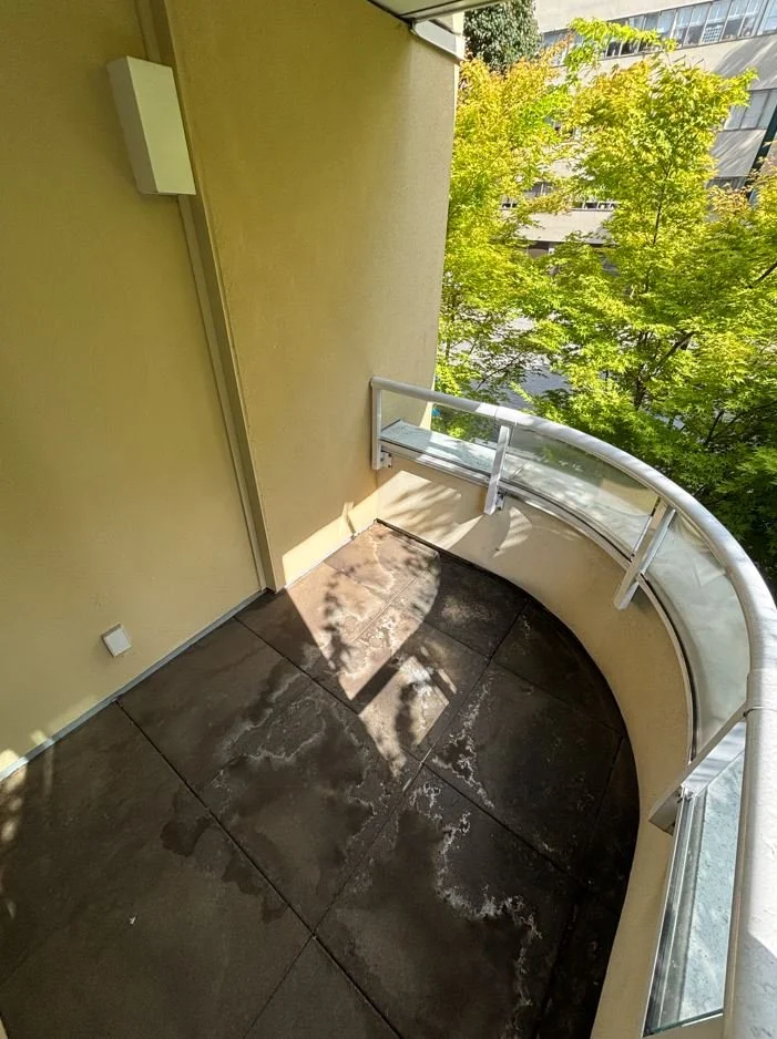 Dirty balcony prior to BalcoScrub's balcony deep cleaning