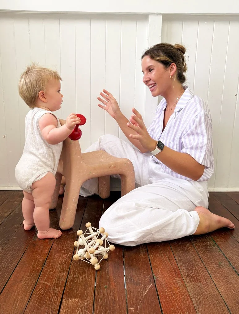 Kinleap paediatric occupational therapist playing with a toddler indoors, supporting strength and coordination development.