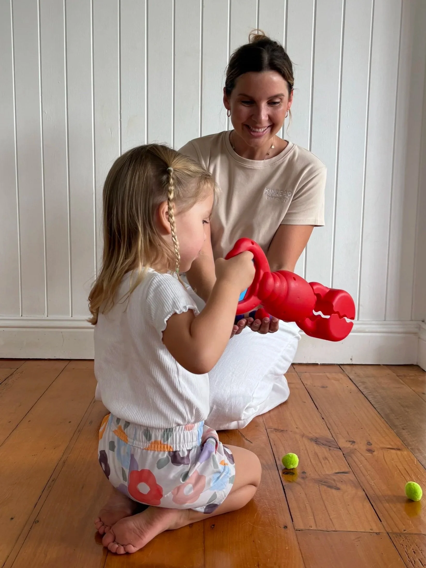 Paediatric occupational therapist developing fine motor skills with a child in Birtinya, Sunshine Coast