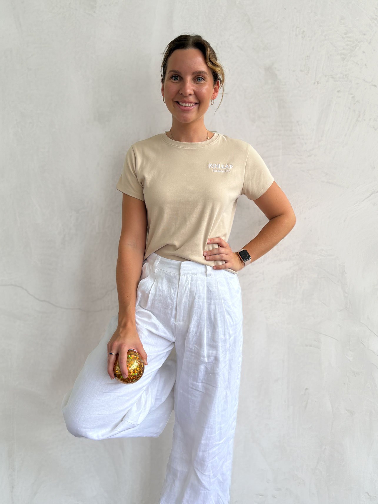 Paediatric occupational therapist Emma Wesche wearing Kinleap shirt, portrait in Birtinya, Sunshine Coast