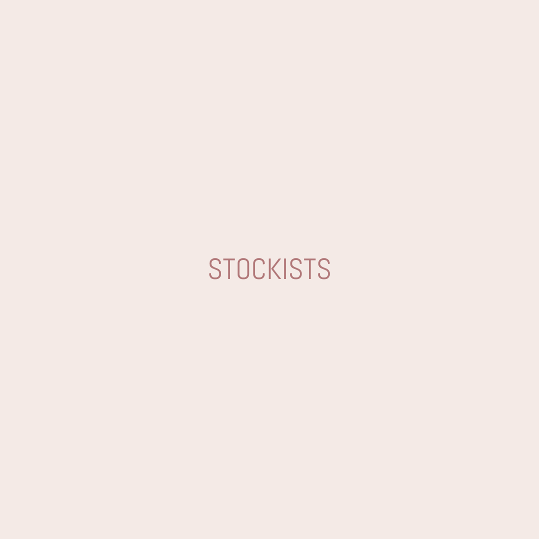 Minimalist plain background with the word 'Stockists' in the center in pinkish-brown font.