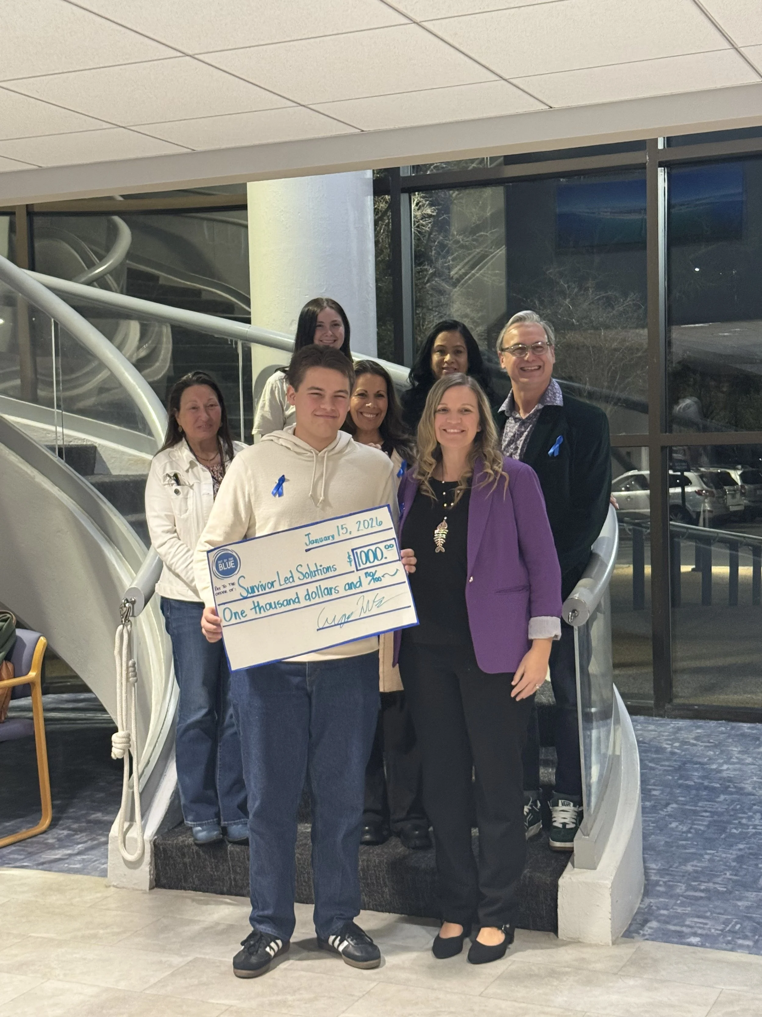 Another $1000 check presented to Survivor-Led Solutions!