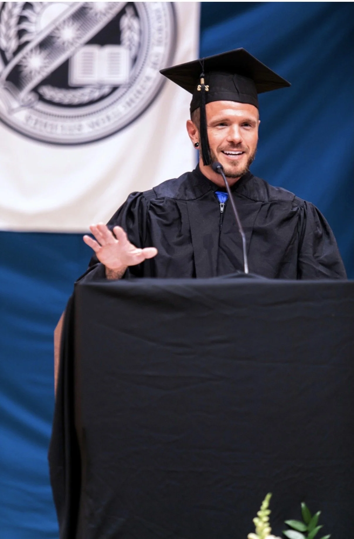 Brian Granneman speaking at his graduate-school commencement