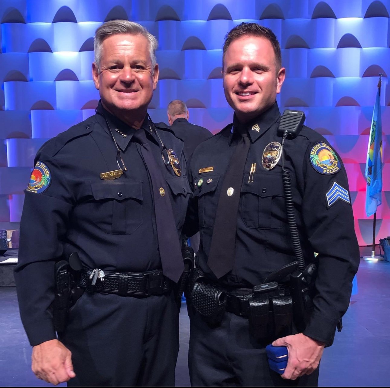 Brian Granneman with his police chief at a ceremony where he received Officer of the Year and a Lifesaving Award