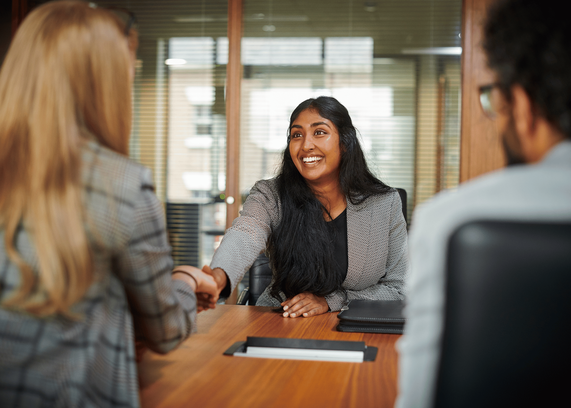 woman shaking hands with interviewer
