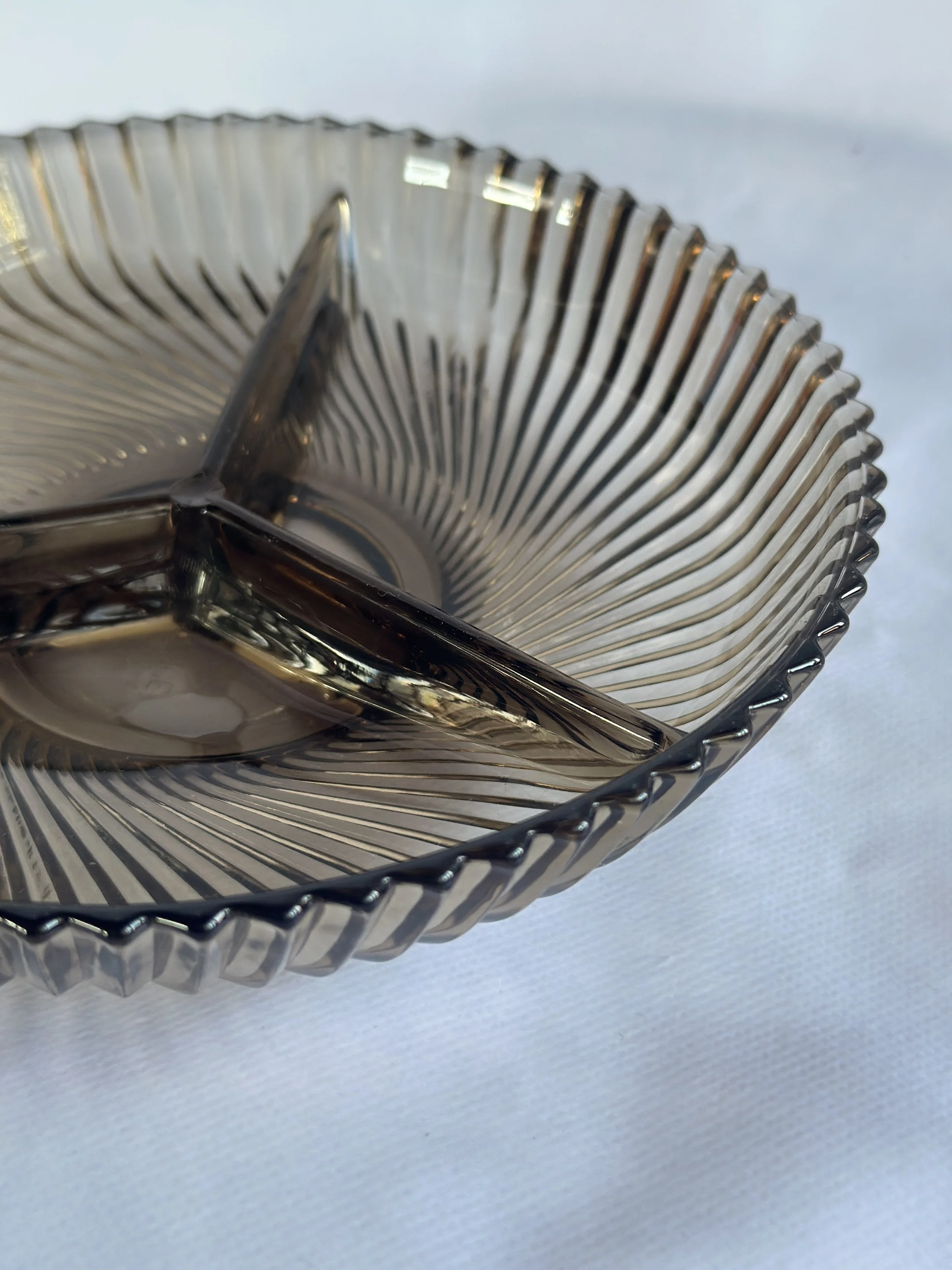 Close-up of a metallic, grid-patterned square ashtray with shiny reflective surfaces on a white background. Available in the Curated by Curtis online Vintage Store. 