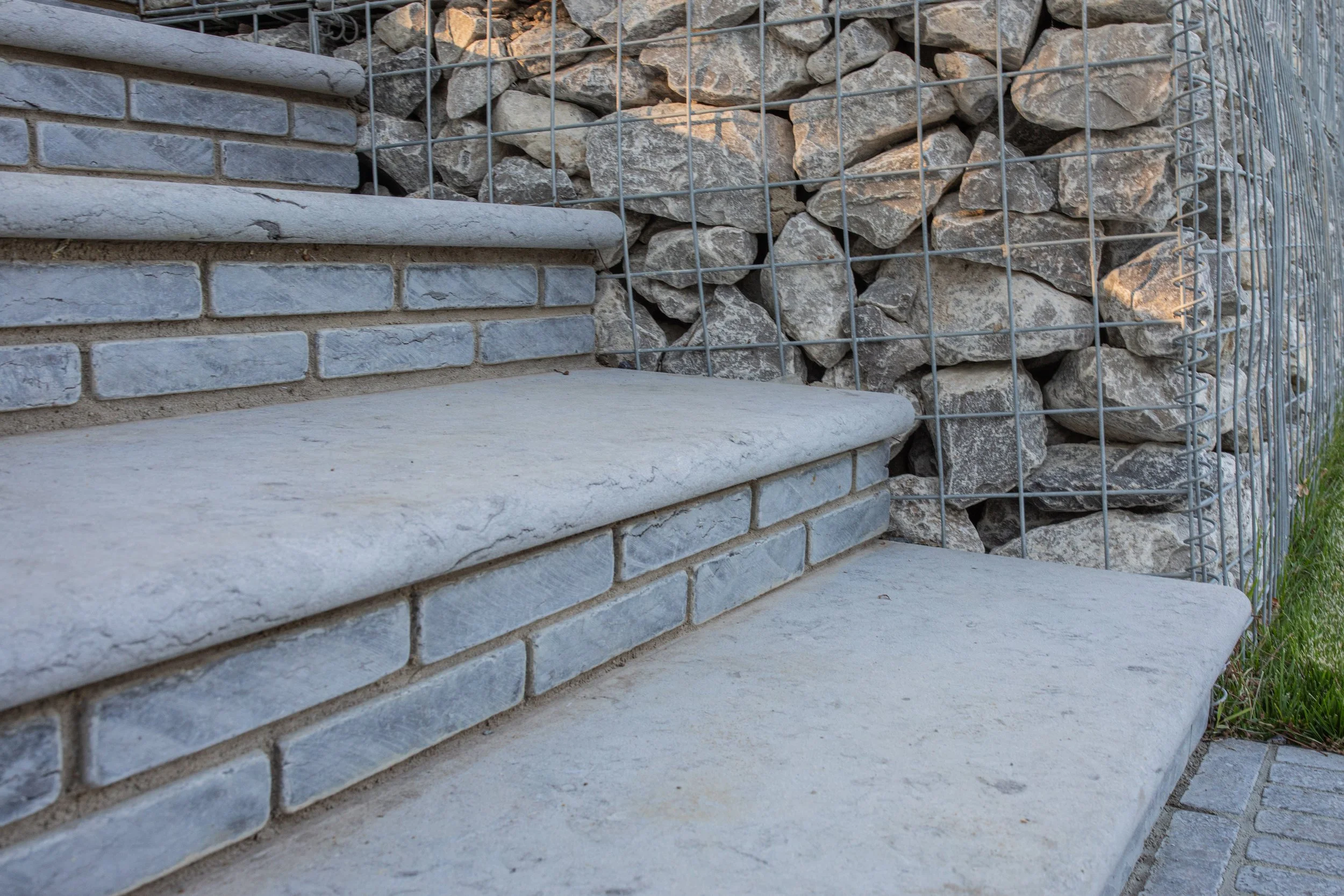 Grey limestone steps with bullnose edge
