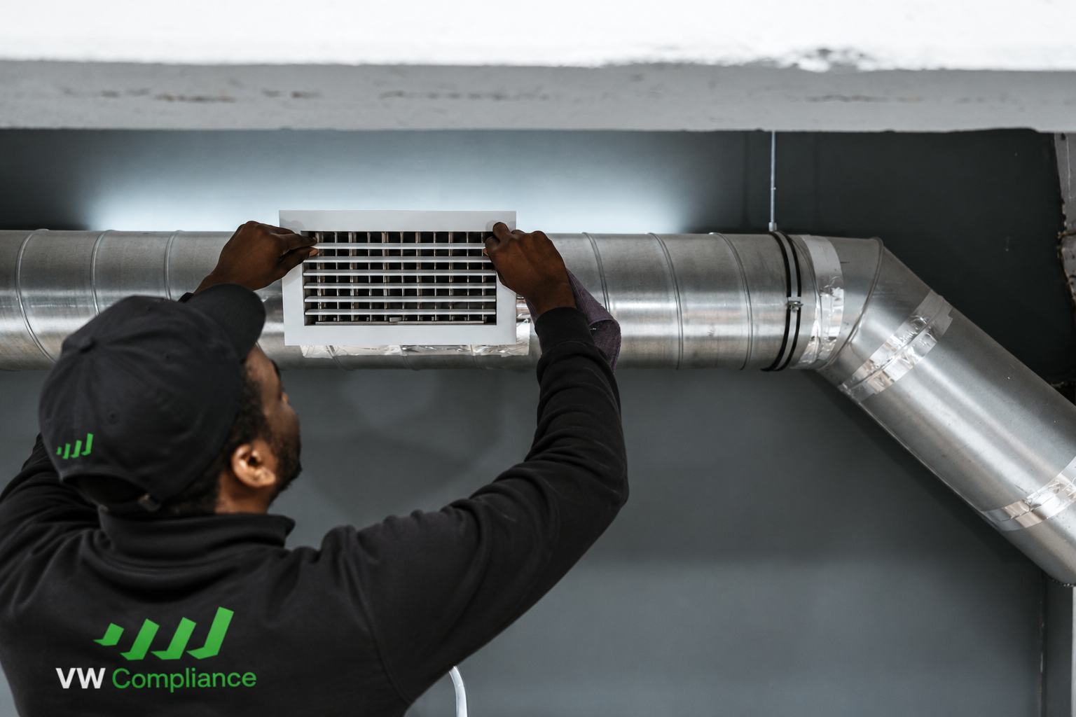 HVAC technician cleaning ventilation ductwork