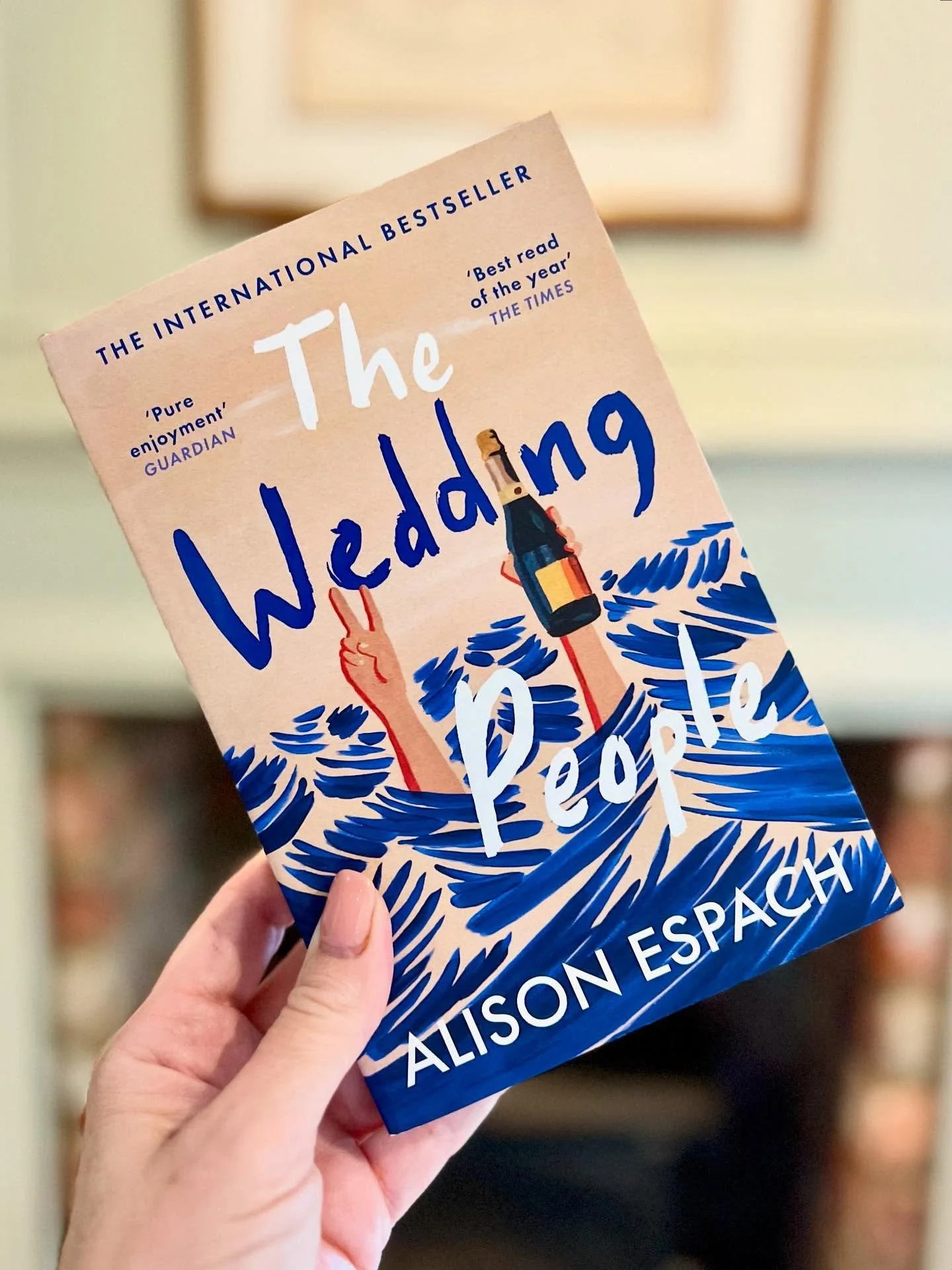 Funny, romantic, sharp and wise - just some of the well-deserved adjectives sprinkling the cover of The Wedding People by Alison Espach. 
Phoebe arrives at a grand hotel in her best dress and at her lowest ebb. She is the only guest not part of the e