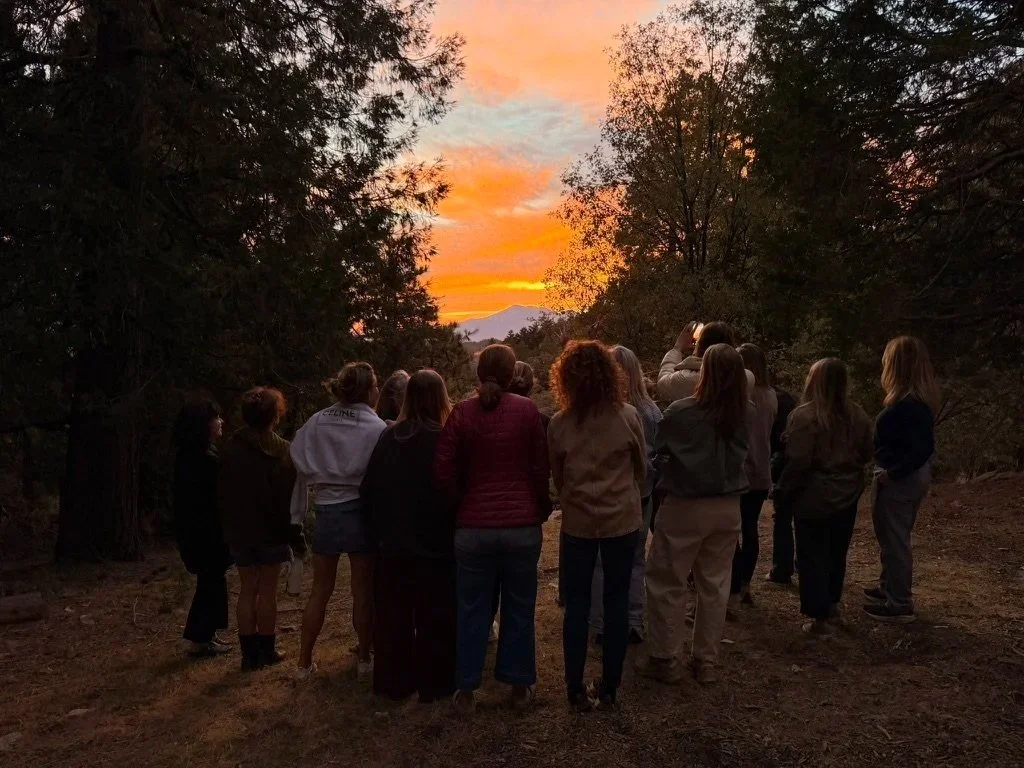 Group of Women looking at beautiful sunset taken from The Perch at Twin Peaks
