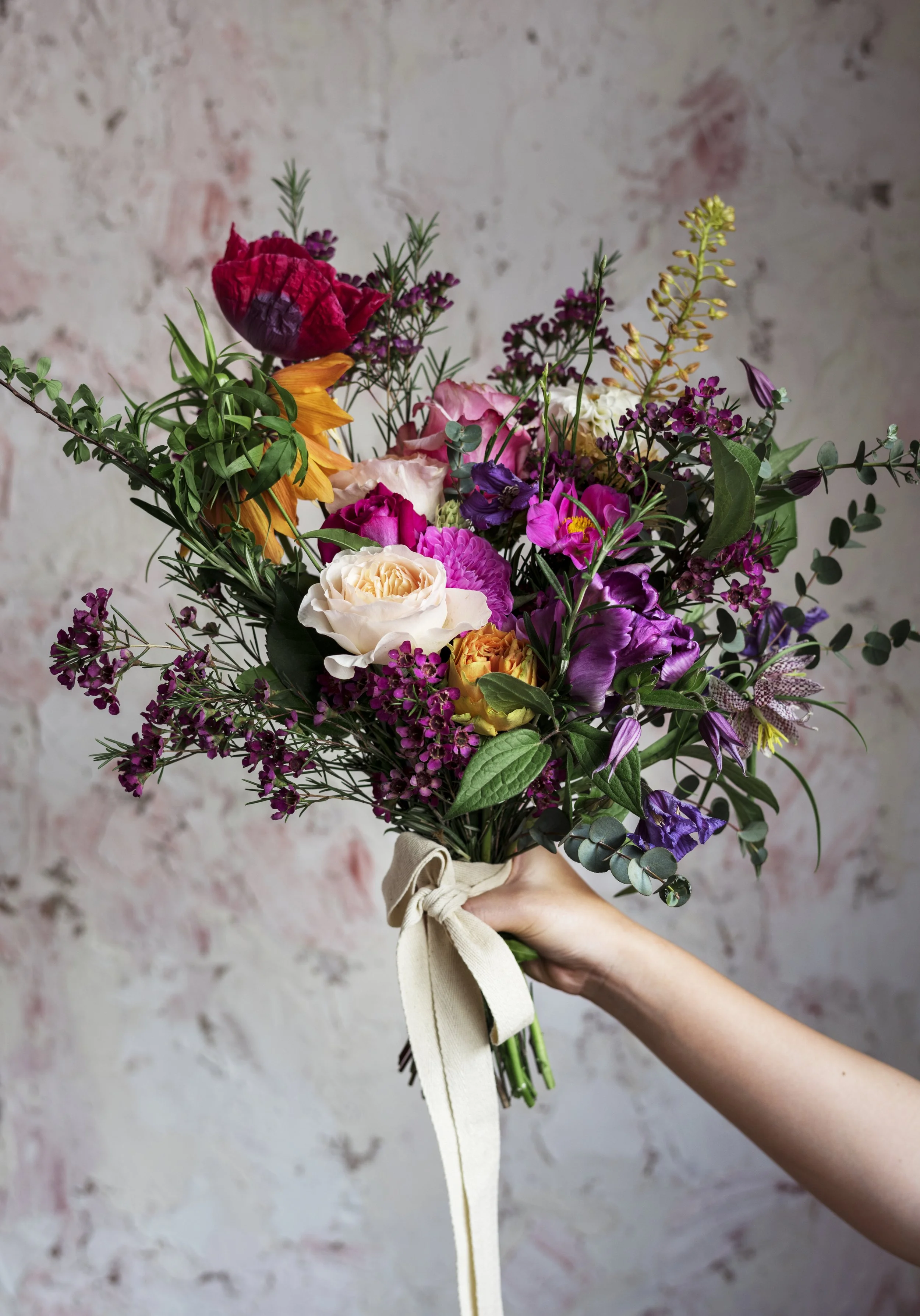peopl-hand-holding-beautiful-flowers-bouquet-2025-02-10-09-11-48-utc.jpg