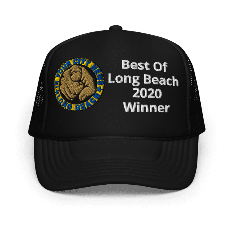 A black trucker cap with a patch and white embroidered text that reads 'Best of Long Beach 2020 Winner.' The patch features a fist and the words 'Long Beach, City of Long Beach.'