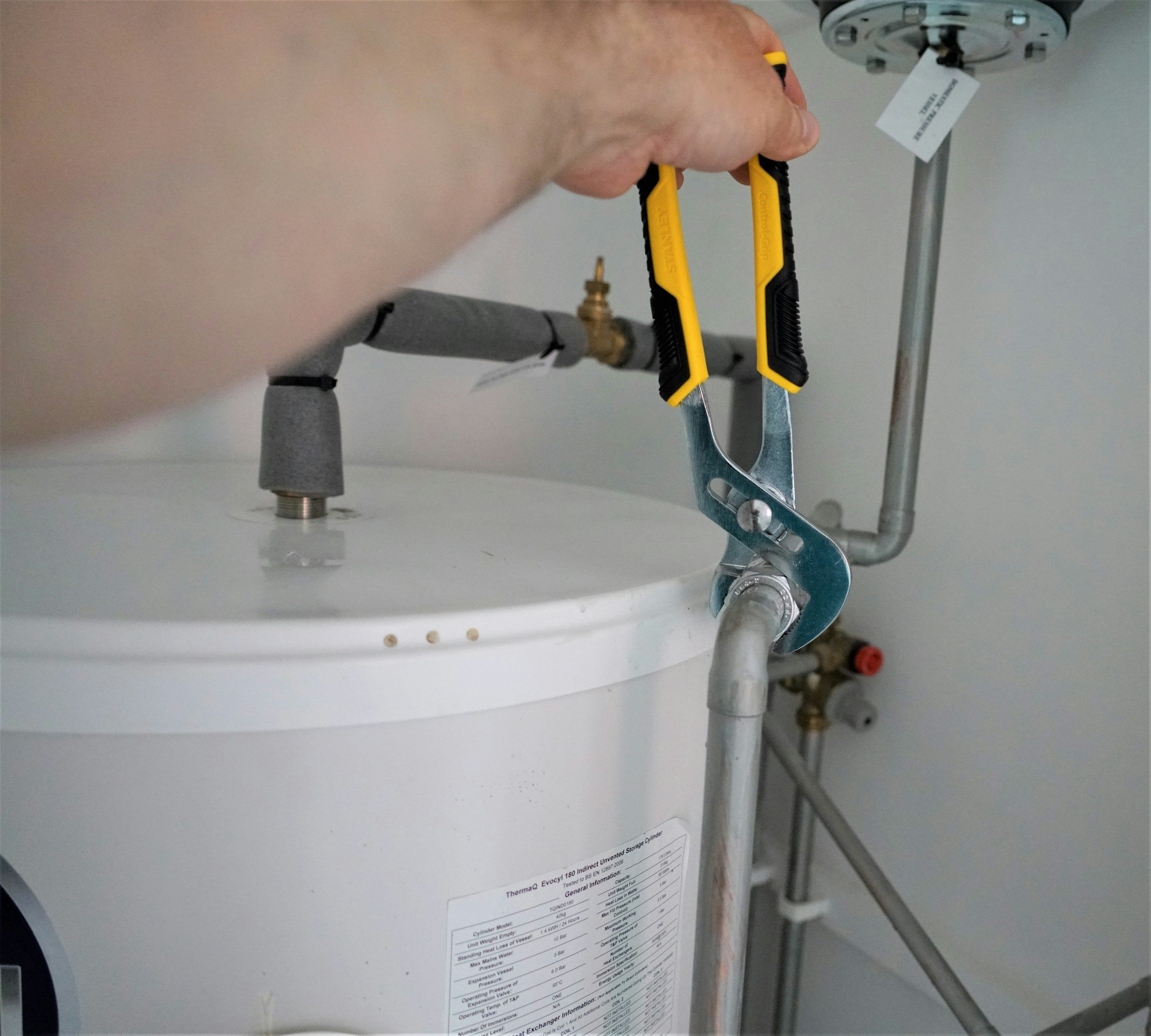 Man fixing hot water heater