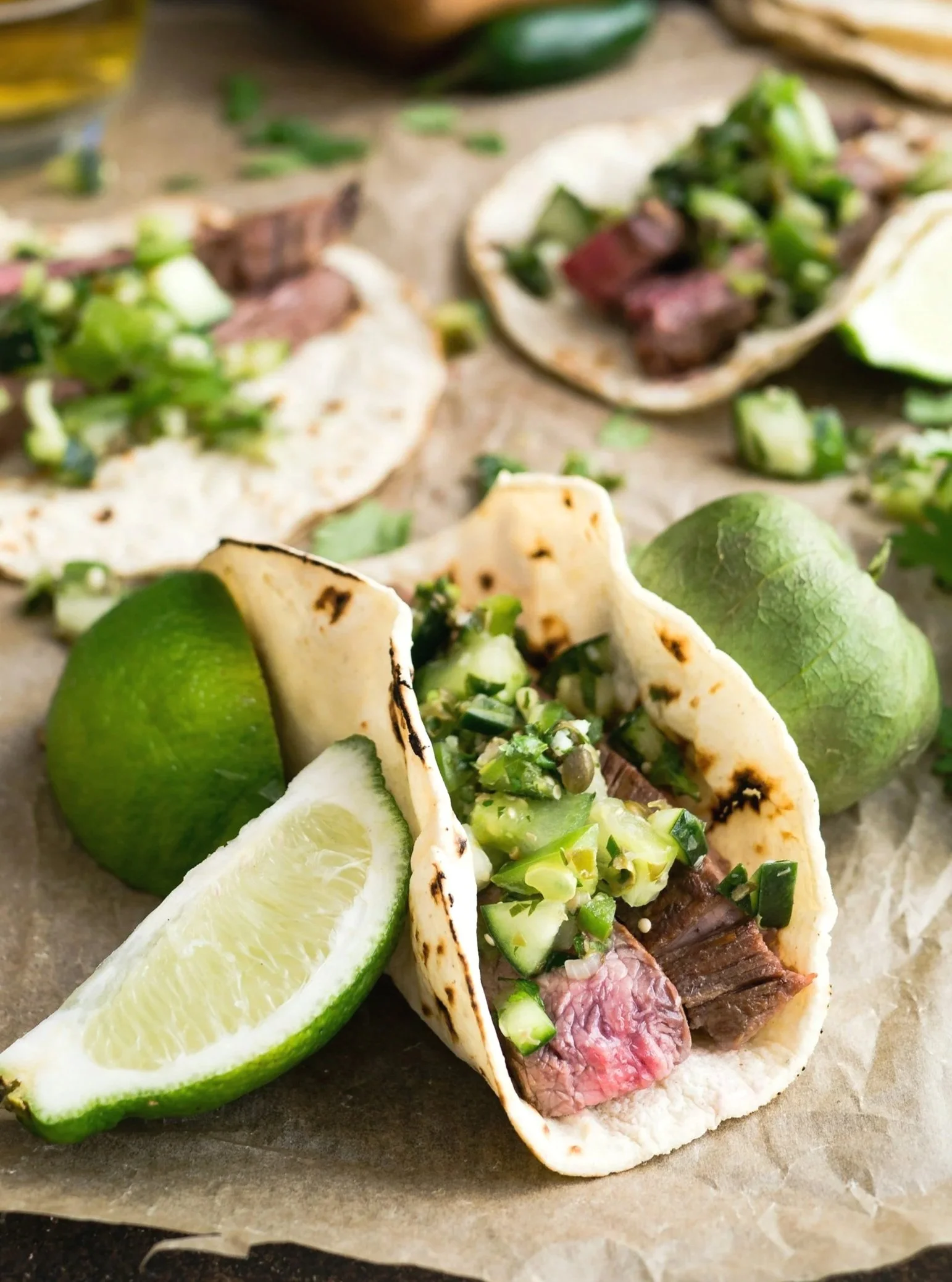 Small meal of steak tacos, with cucumber-parsley salsa verde and pumpkin seeds in a toasted soft taco, showing a nutrient-dense meal in a smaller portion.