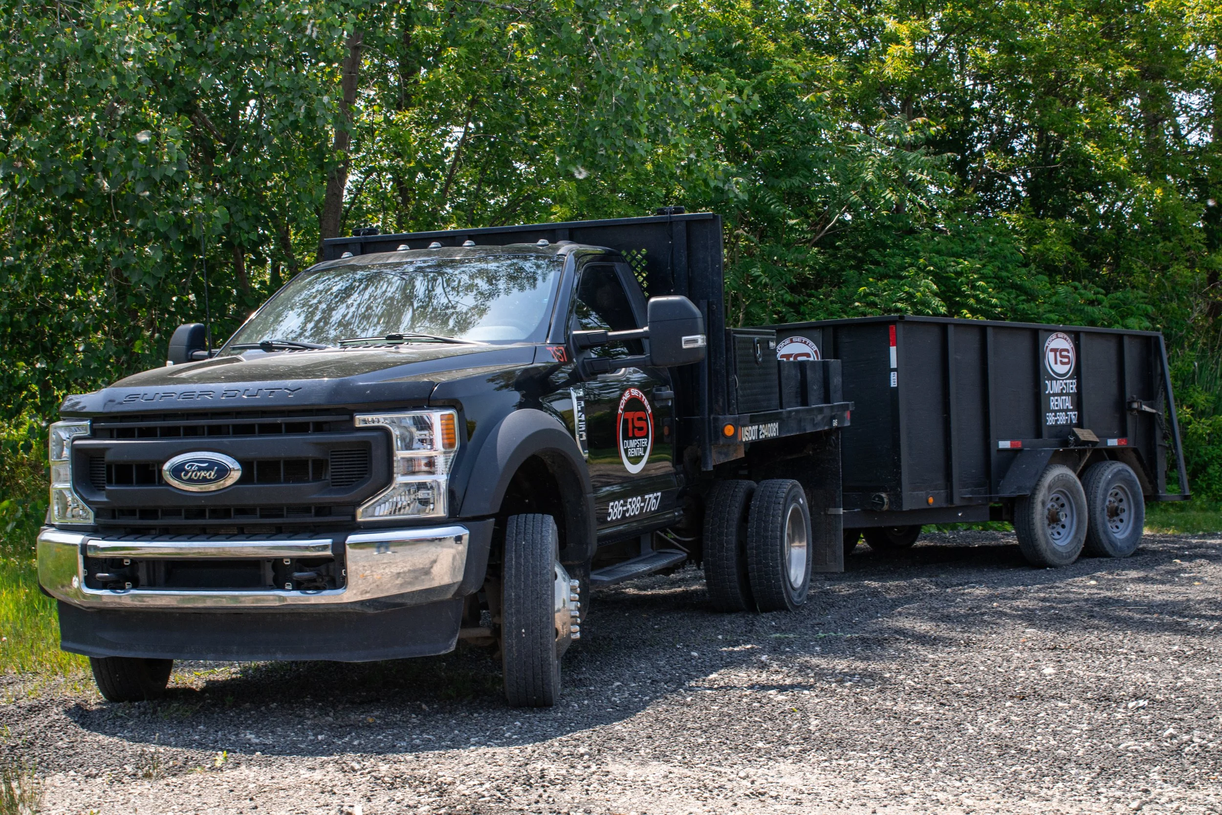 Oranssi technician working on a roof project