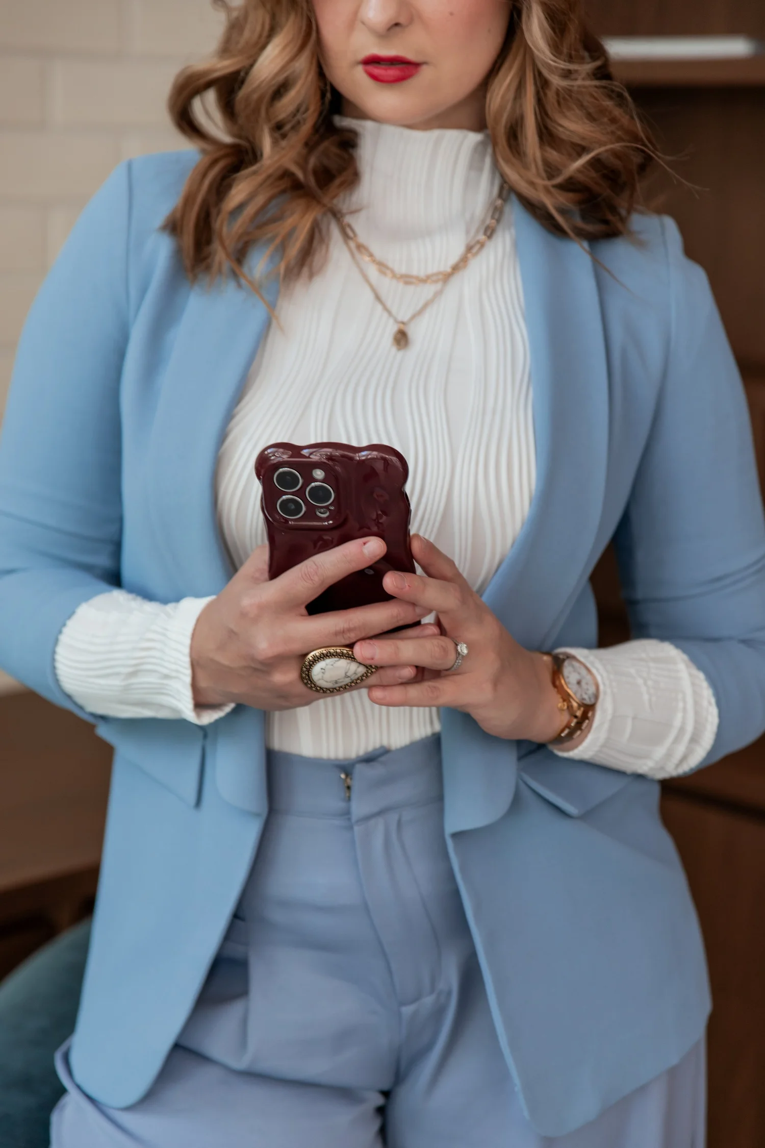 Cass holding her phone
