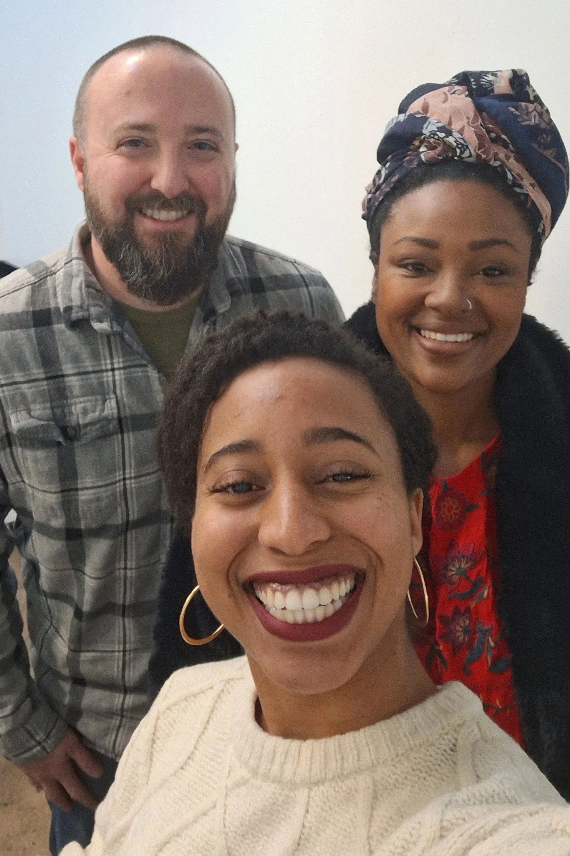 Picture of Rachael Osborne smiling with her seller clients on closing day