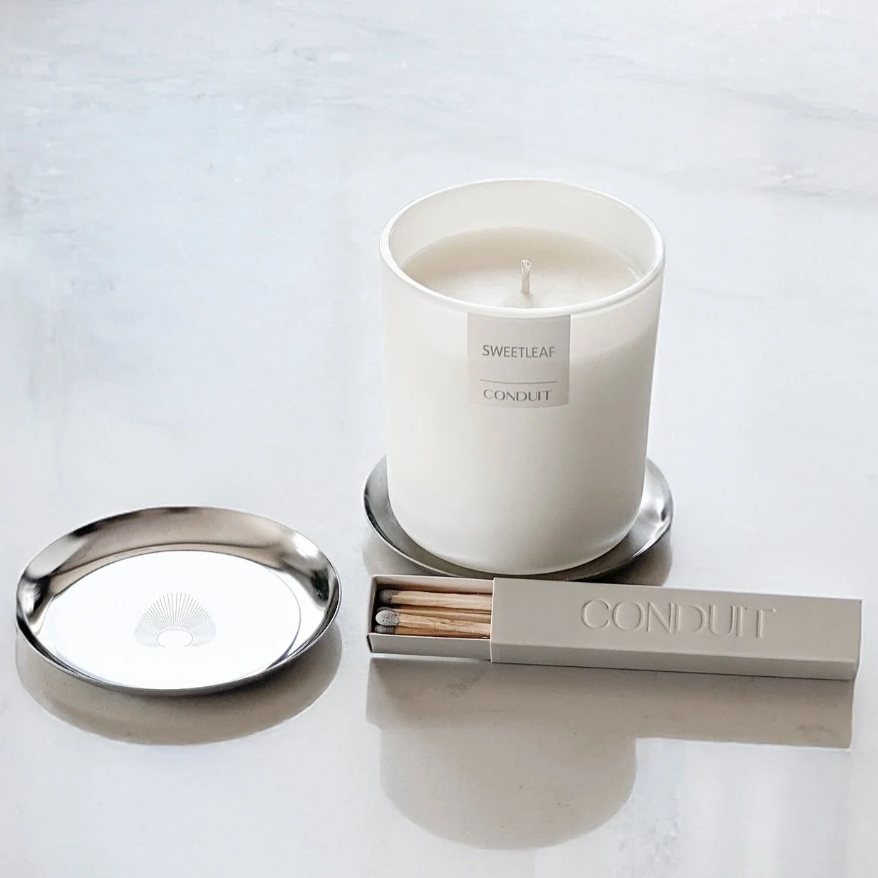 A little gift to mark the arrival of SWEETLEAF.

To celebrate its addition to the collection, we&rsquo;re including a complimentary candle tray and matchbox with every SWEETLEAF order&mdash;now through June 30.

This limited-time offer is available e