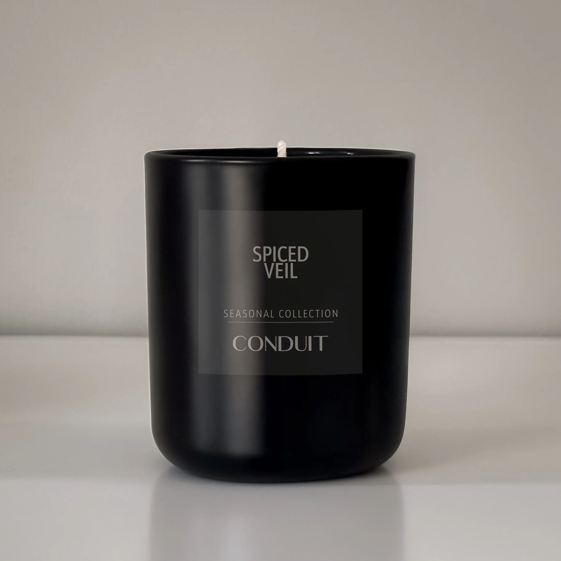 Spiced Veil candle in black glass.