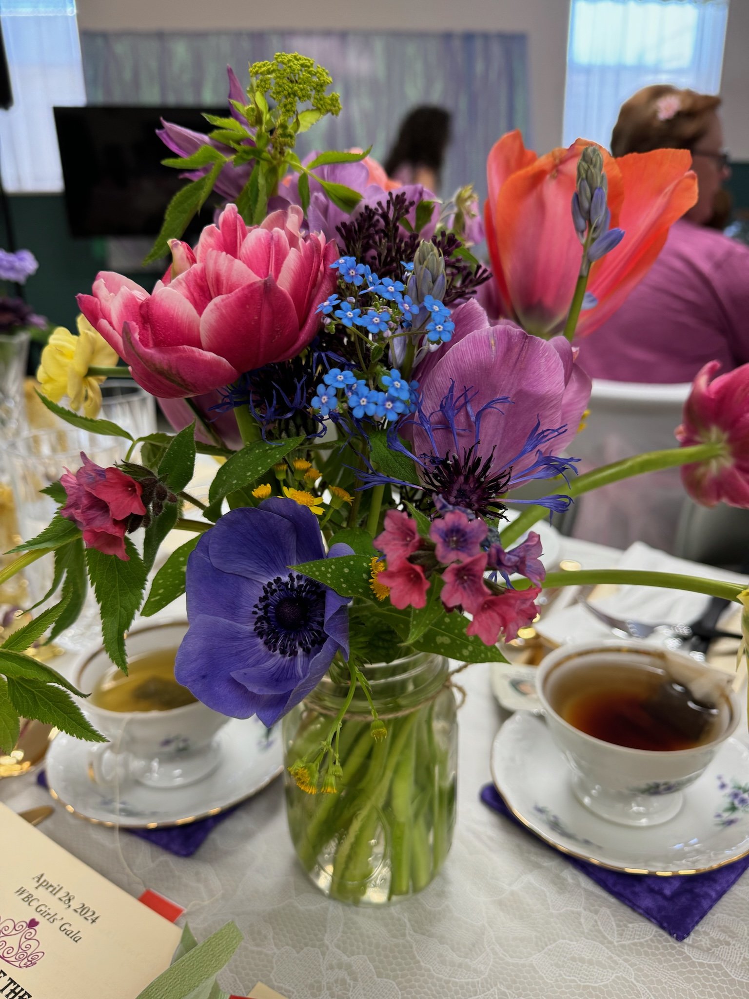 A medium bouquet for a church event in early/mid spring... I can't get enough of the anemones (the dark blue flower in the lower left).
