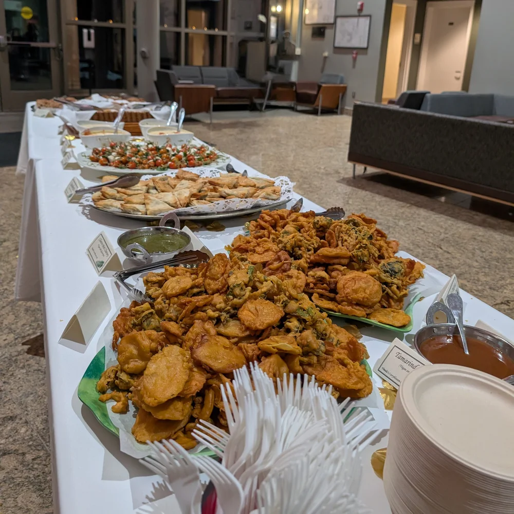 Full buffet spread set up in a campus building lobby