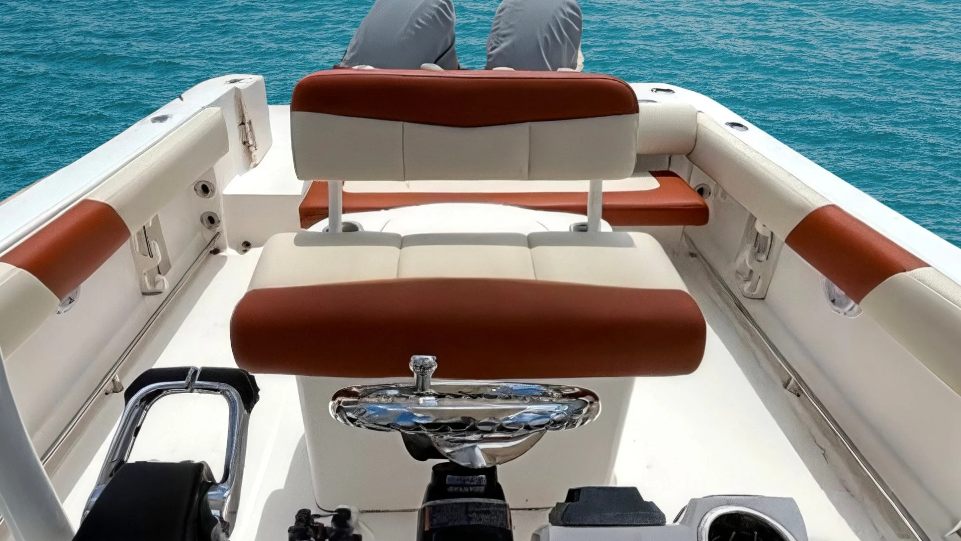 Premium helm station restoration. These captain’s chairs were stripped to the frame and rebuilt with reinforced stitching and ergonomic bolstering. The crisp earth tone marine-grade upholstery brings comfort to all corners of this boat providing supe