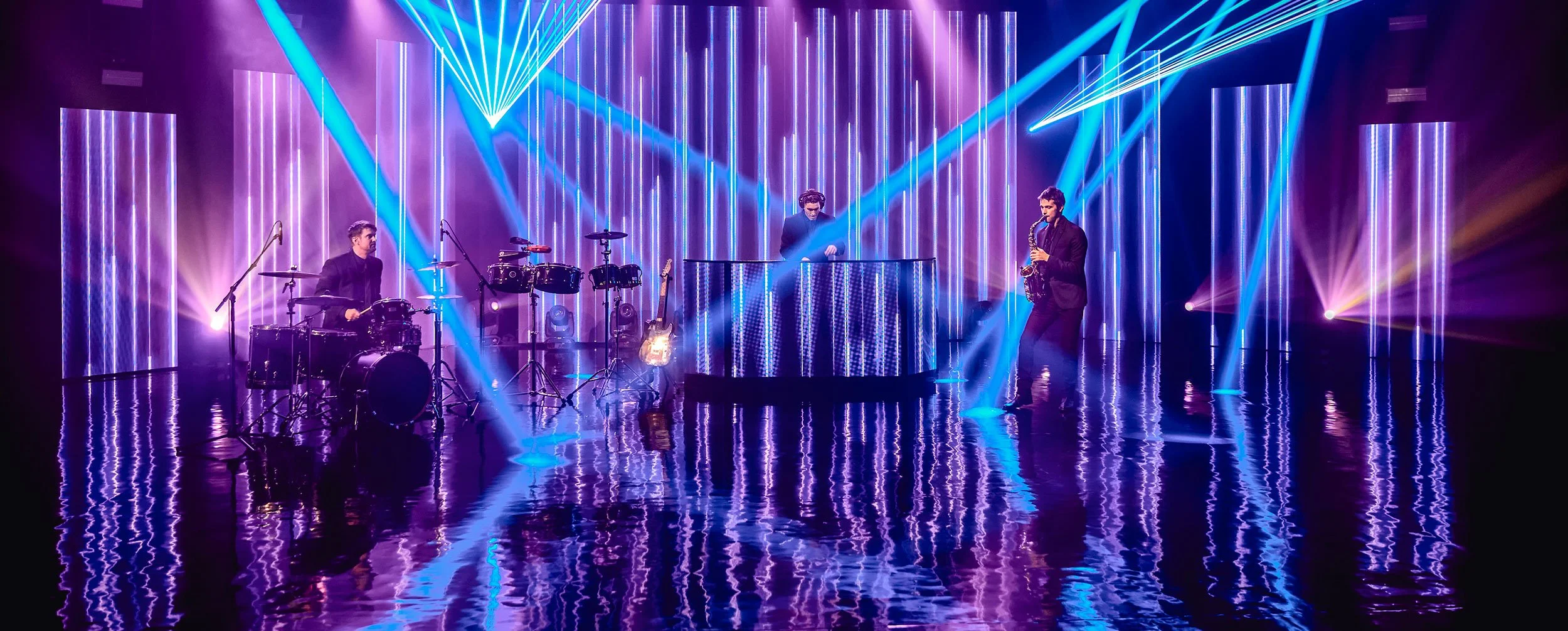 DJ performs with drums and sax at a luxury corporate event in New York