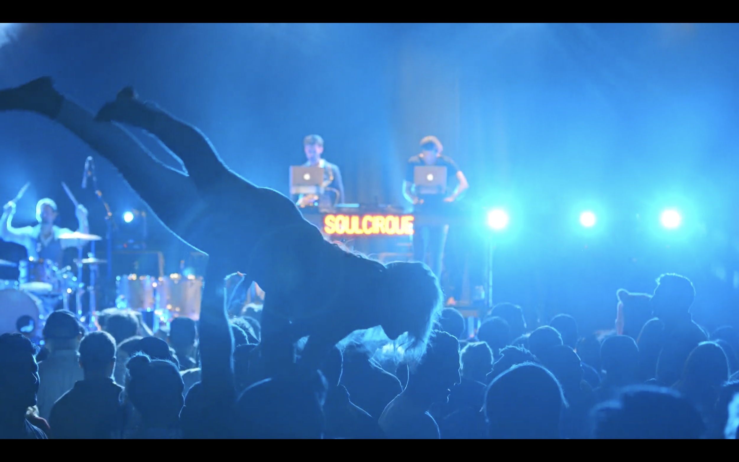 Drummer and sax performing with DJ in Hawaii with energetic crowd