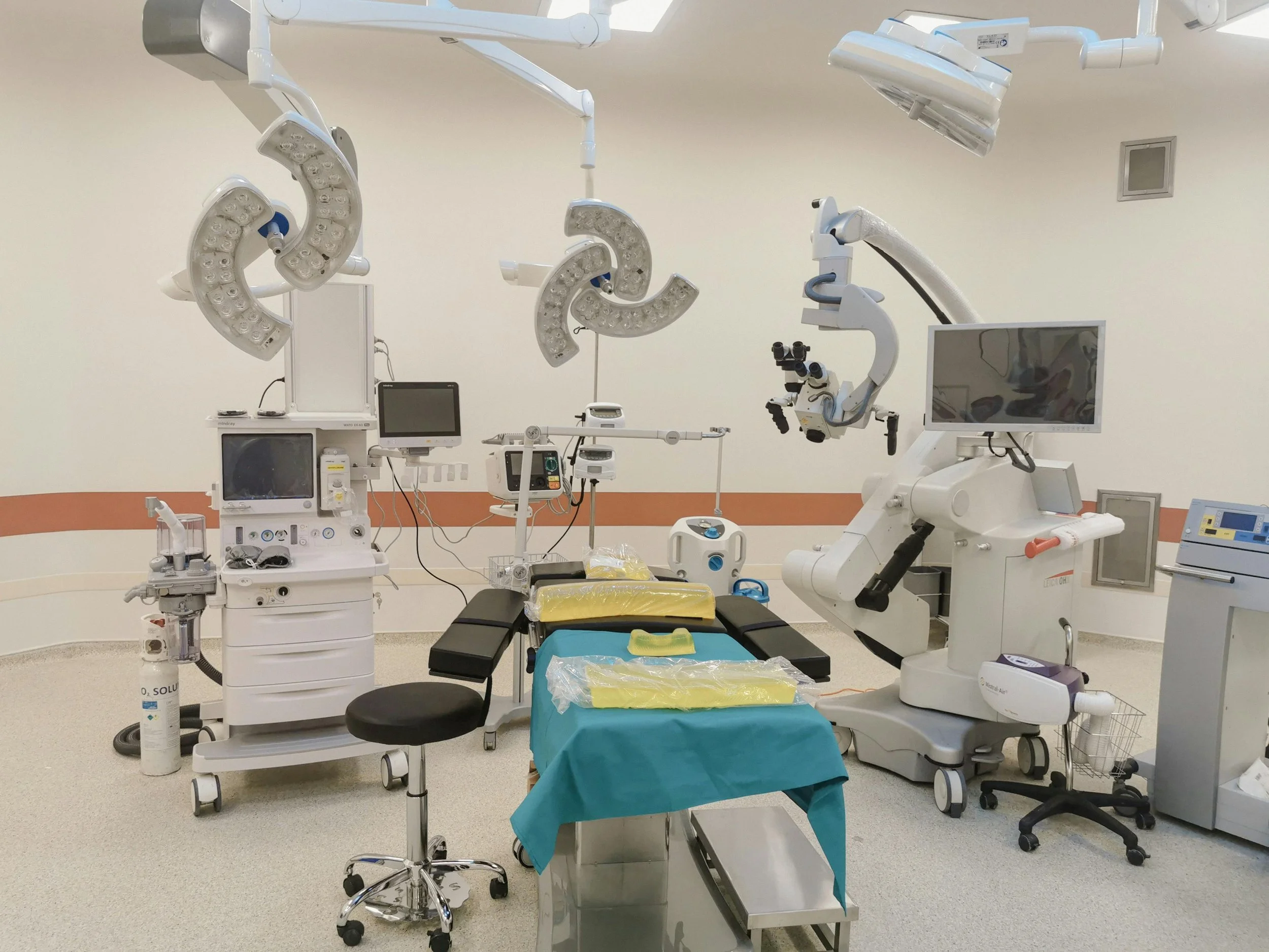 Medical surgical equipment with display monitors, stools, and operating tables and accessories