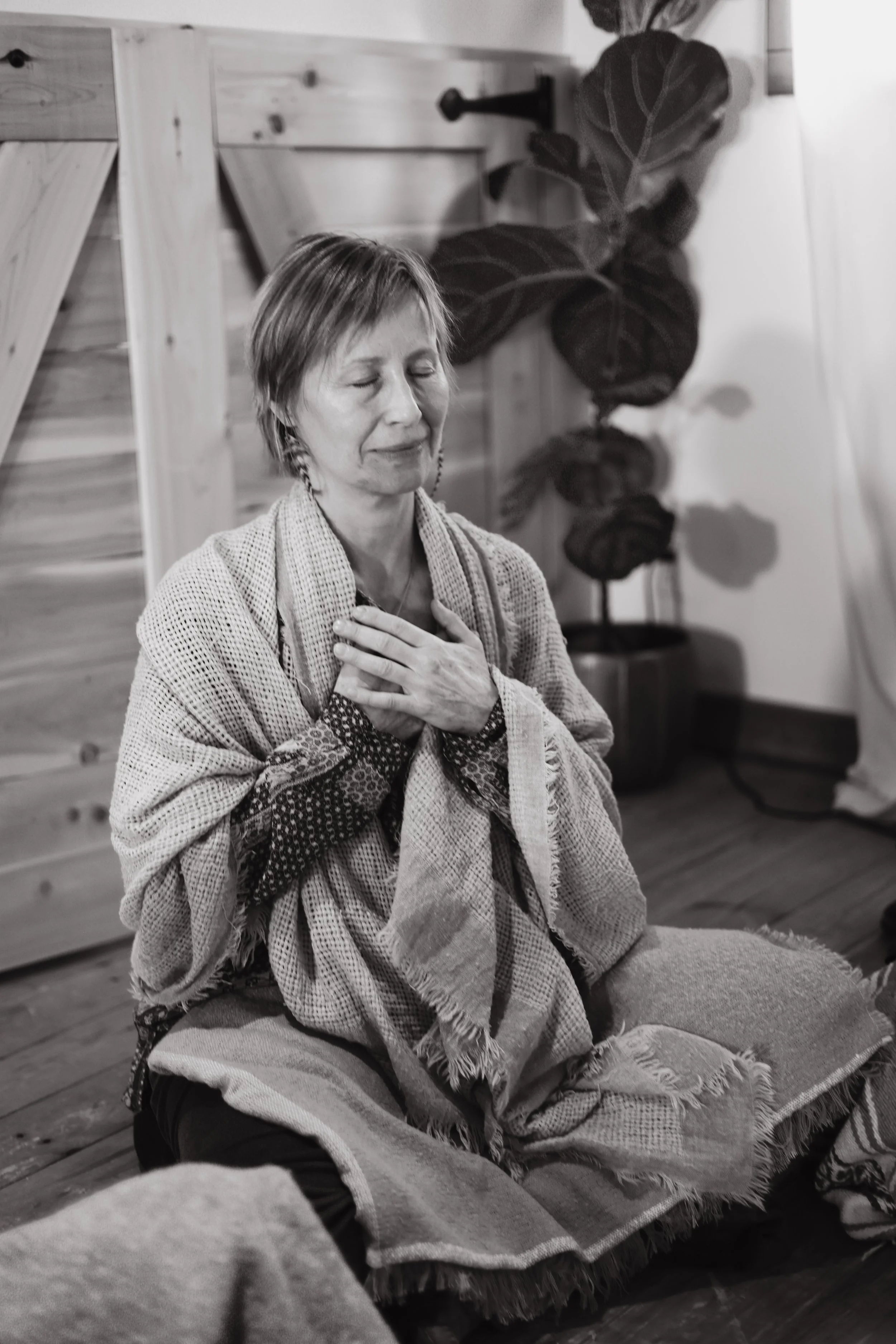 a woman in deep meditation at the seed lodge at rest and reconnect