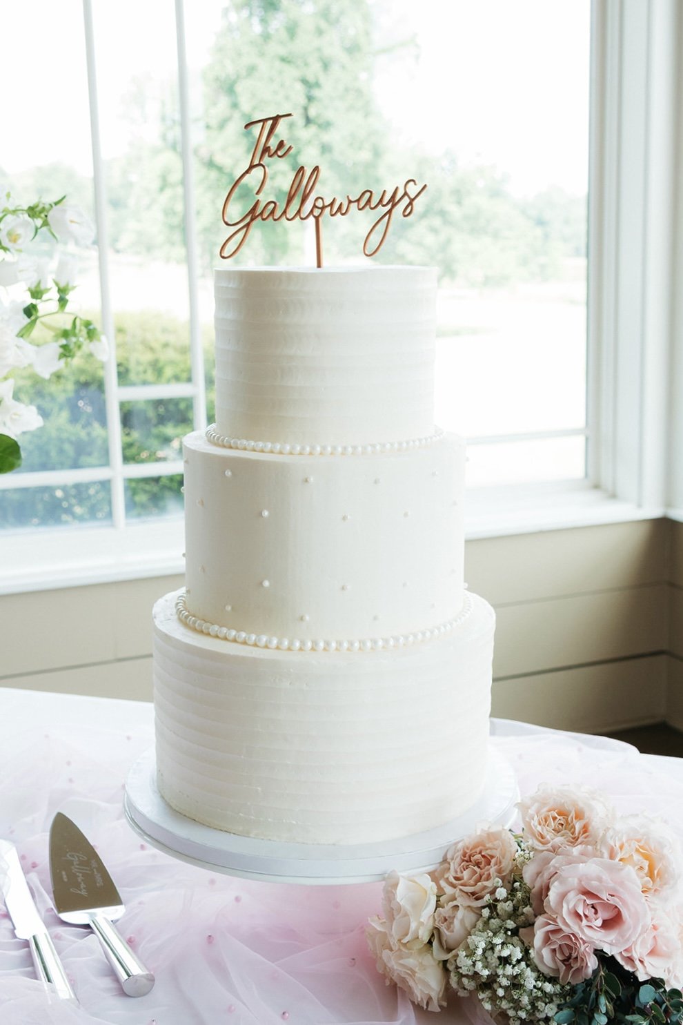 Classic Wedding Cake with textured ridges and pearls.jpg