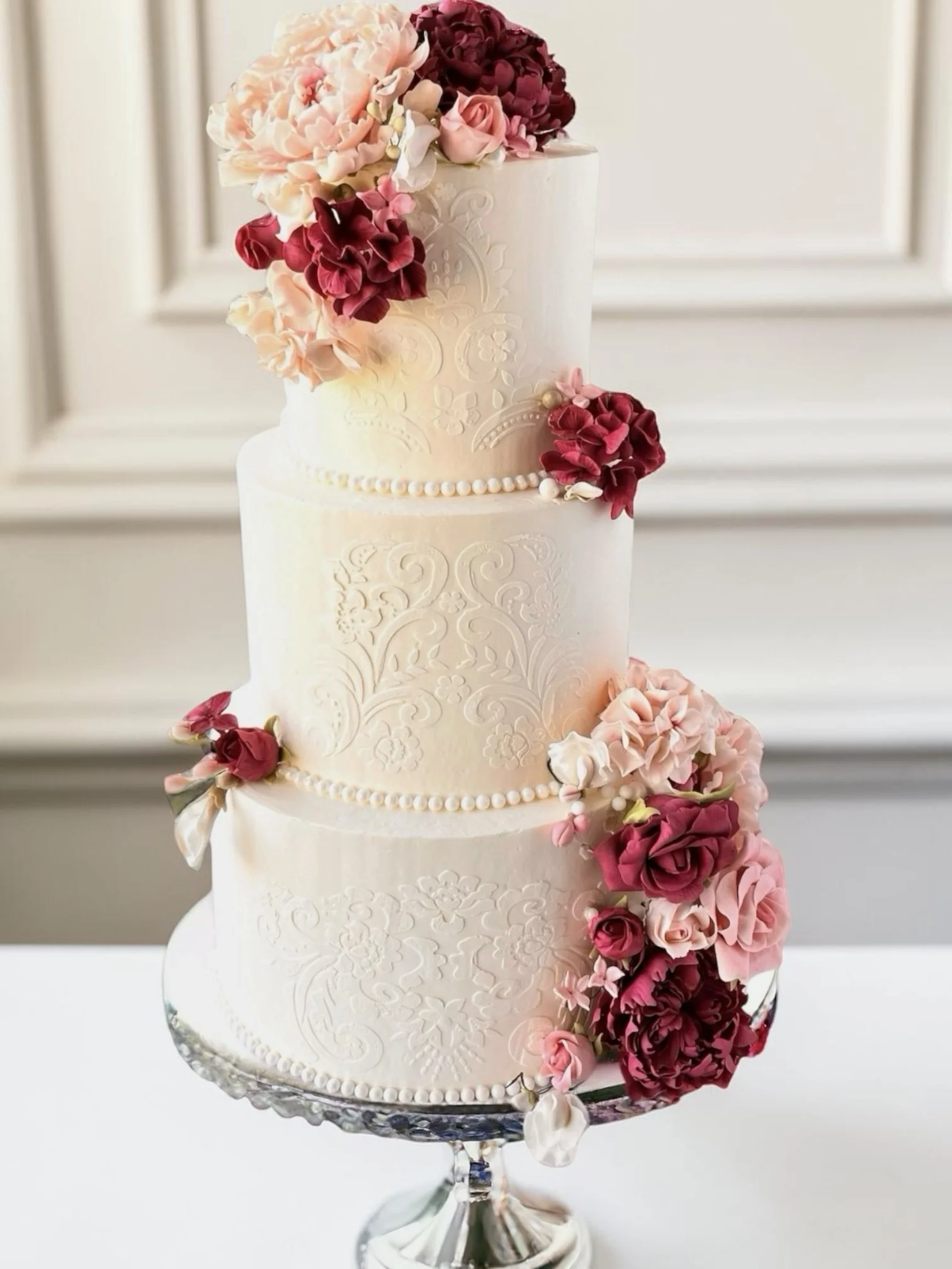 Wedding Cake with Damask stenciling and Luxury sugar flowers.JPG