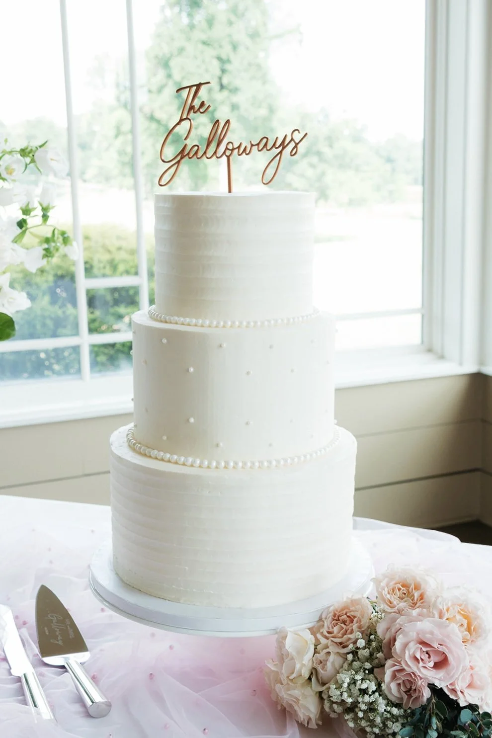 Classic Wedding Cake with textured ridges and pearls.jpg