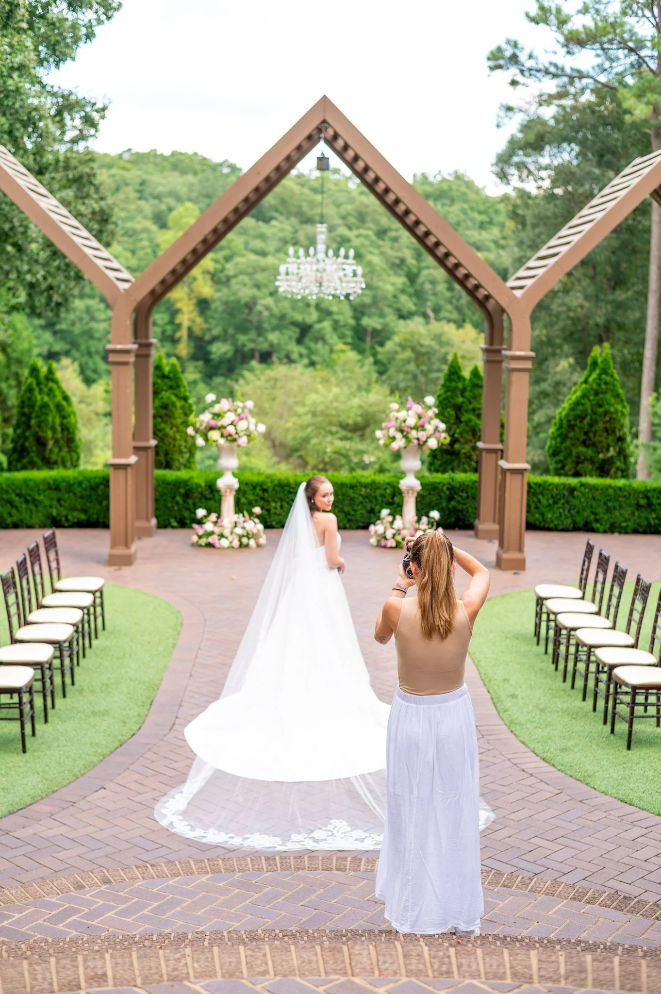 Photo of photographer taking a picture of bride