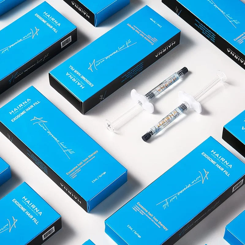 Multiple boxes of Hairna exosome hair fill product arranged on a white surface, with two syringes filled with the product placed in the center.