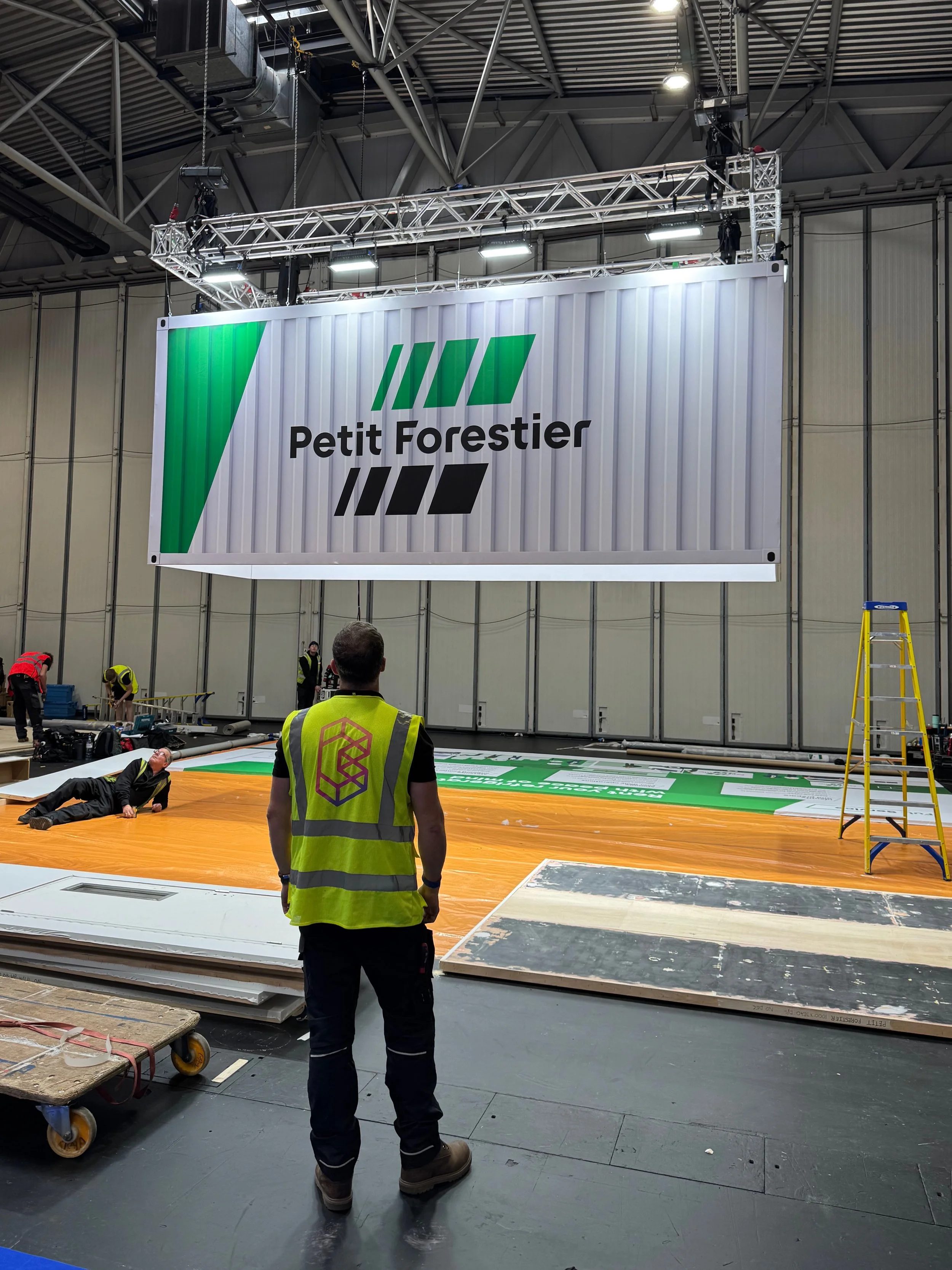 The power of illusion. This shipping container was built using our lightweight aluminium hire framing and finished with large-format SEG tension fabric graphics to create a seamless, high-impact display.