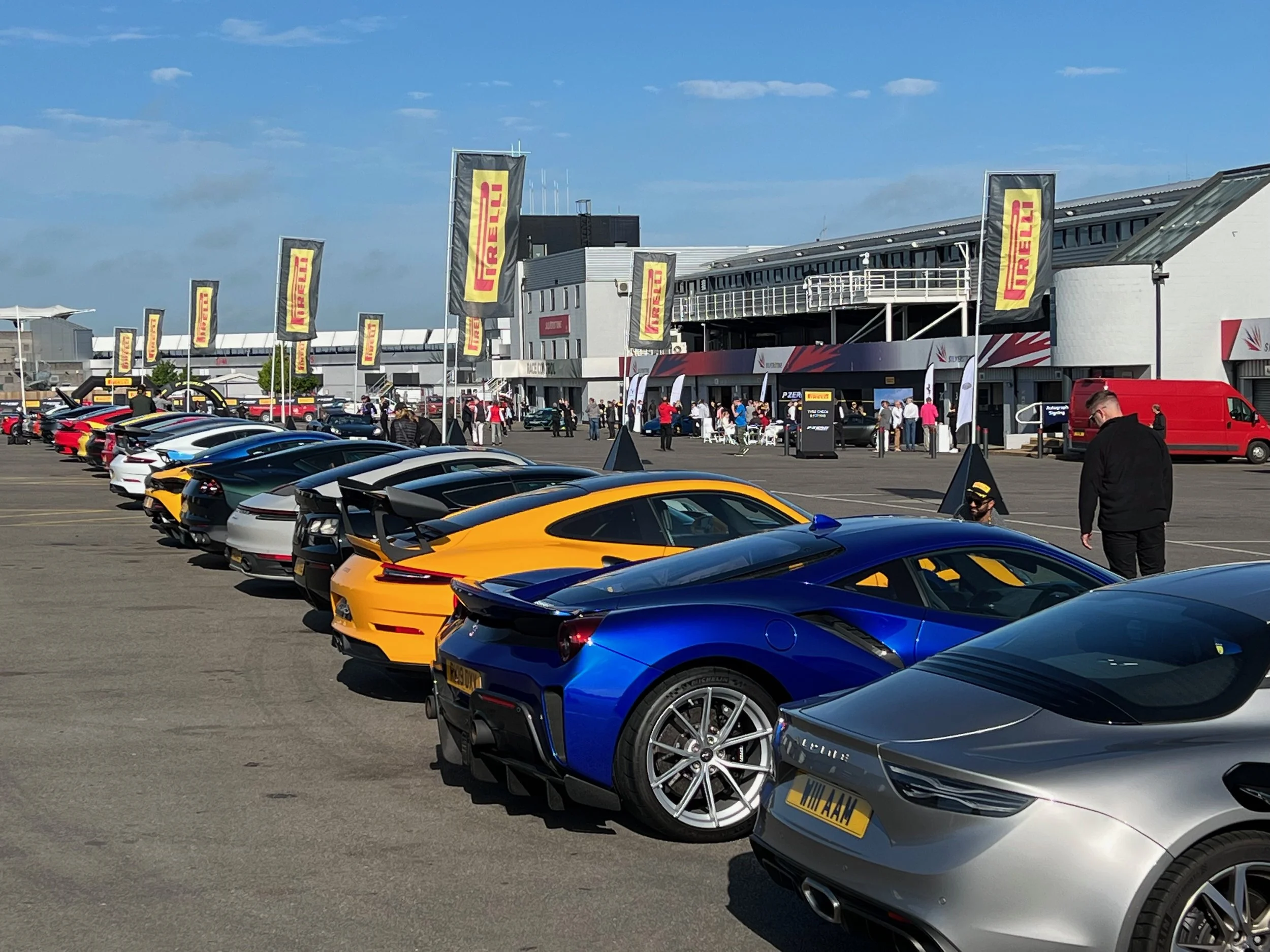 Large-scale flags were used to frame the external paddock area at this track day event, adding brand impact and visibility.