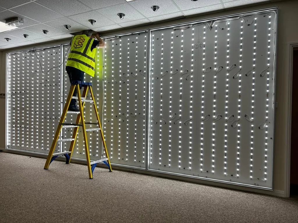 We built and installed this rear-illuminated, large-format tension fabric graphic wall to deliver seamless graphics and maximum visual impact.