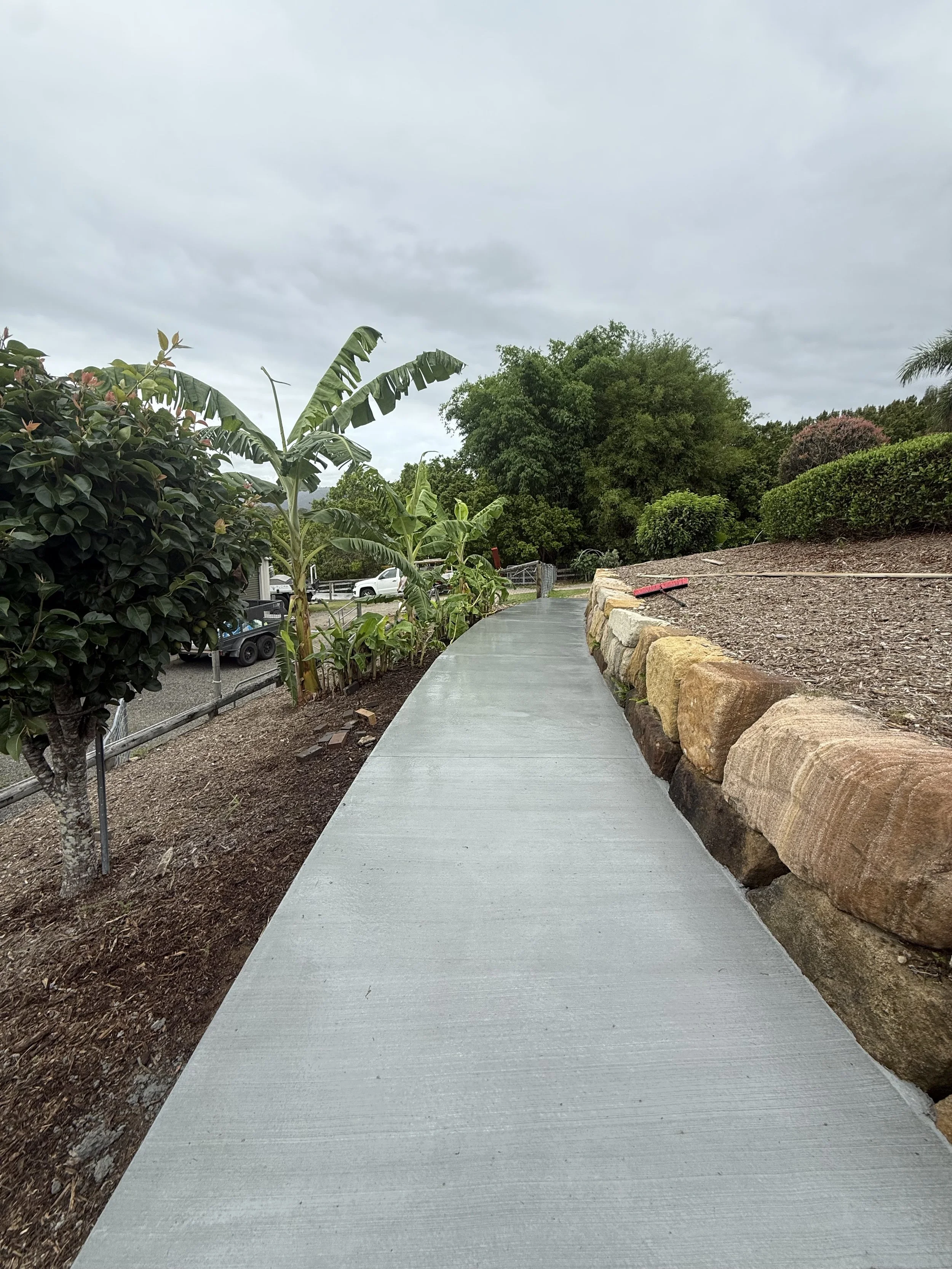 Freshly poured concrete pathway work by Dark Horse Concreting
