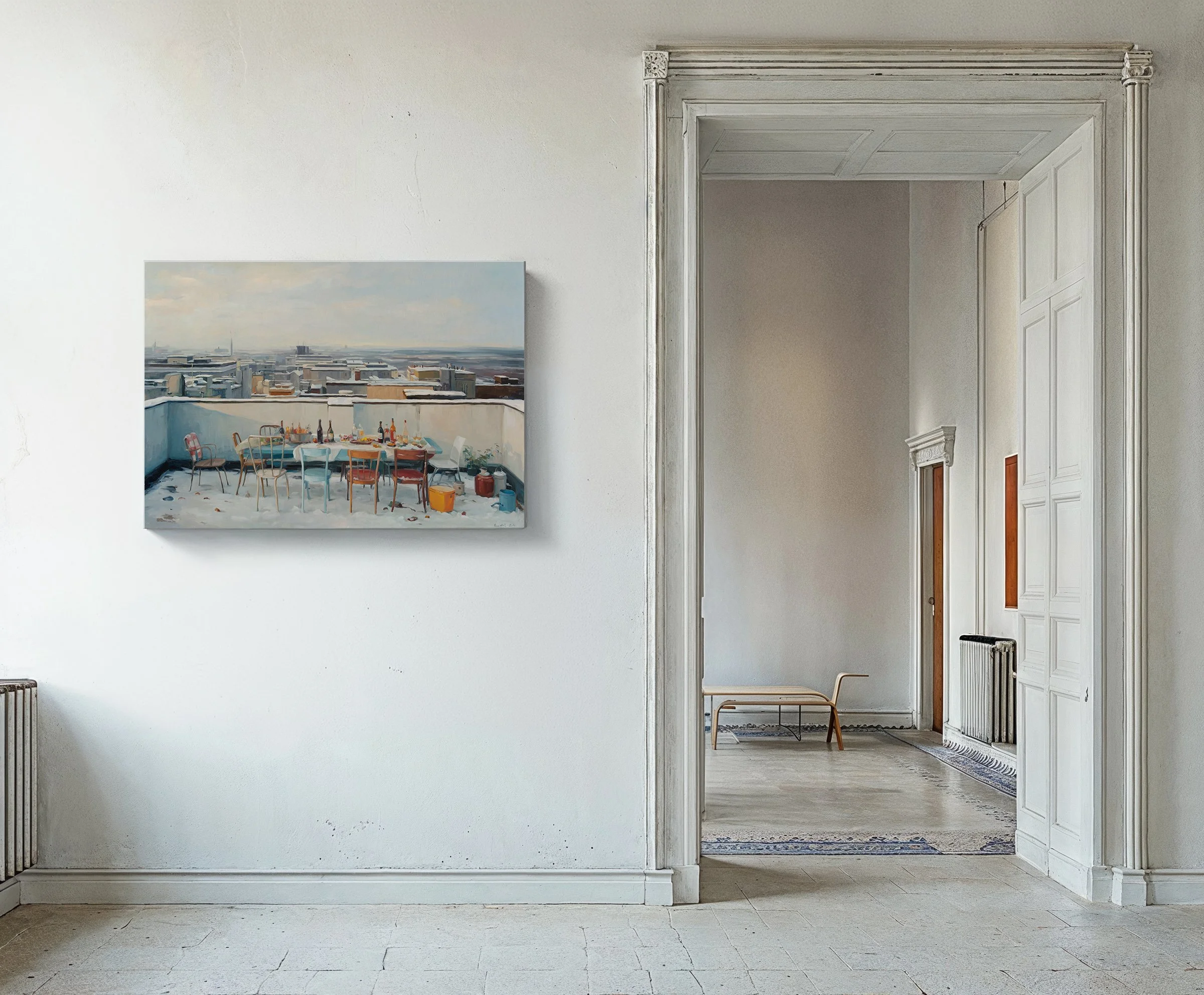 Art gallery with a painting of a rooftop scene with a table and chairs, seen through a doorway with decorative trim.