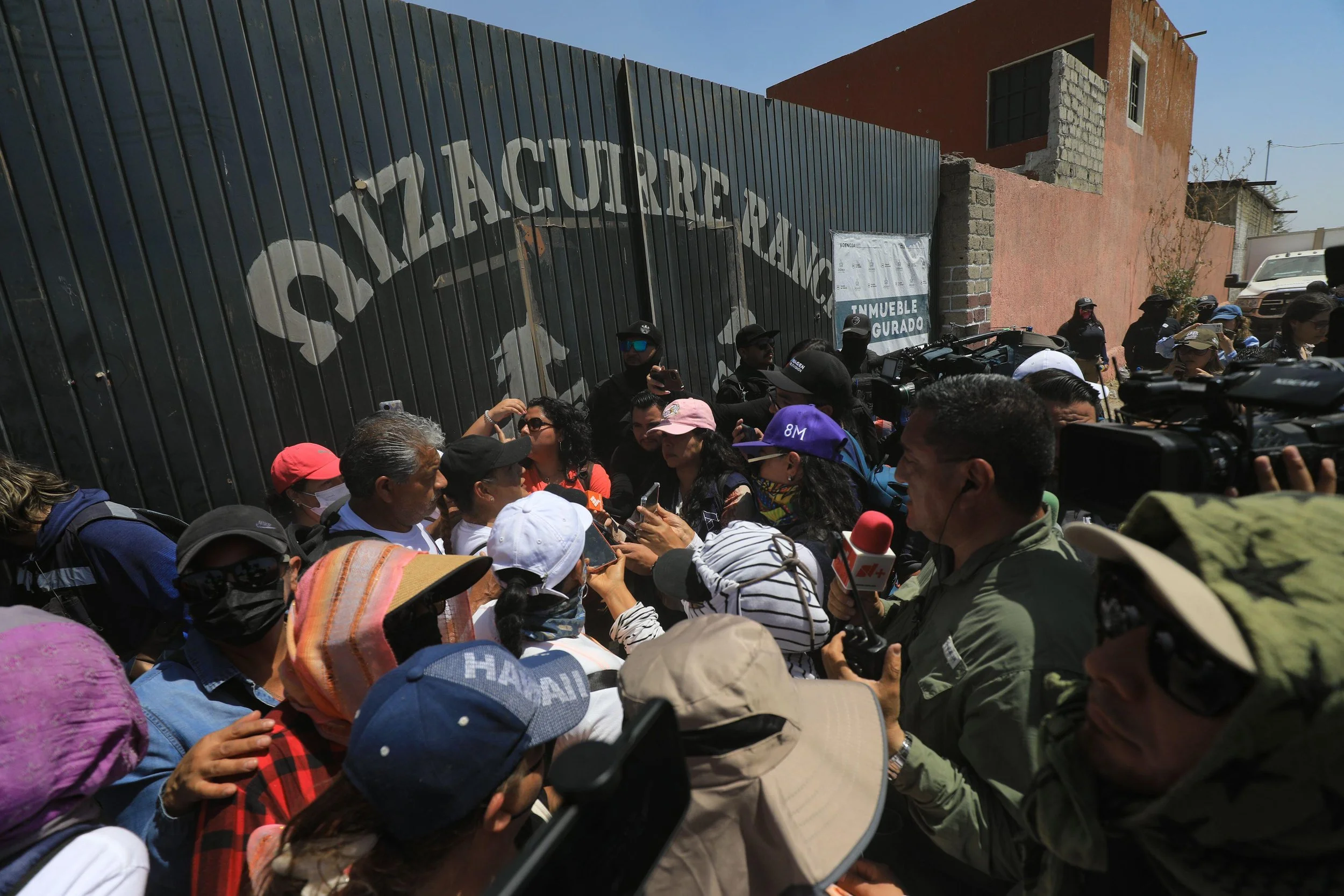 Mexican reporters and families of disappearance victims outside Izaguirre Ranch, Jalisco.
