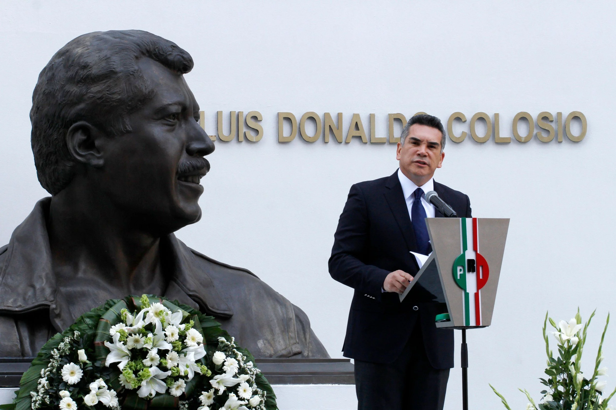 Alito Moreno, President of the PRI in Mexico, speaks before a bust of Luis Donaldo Colosio.